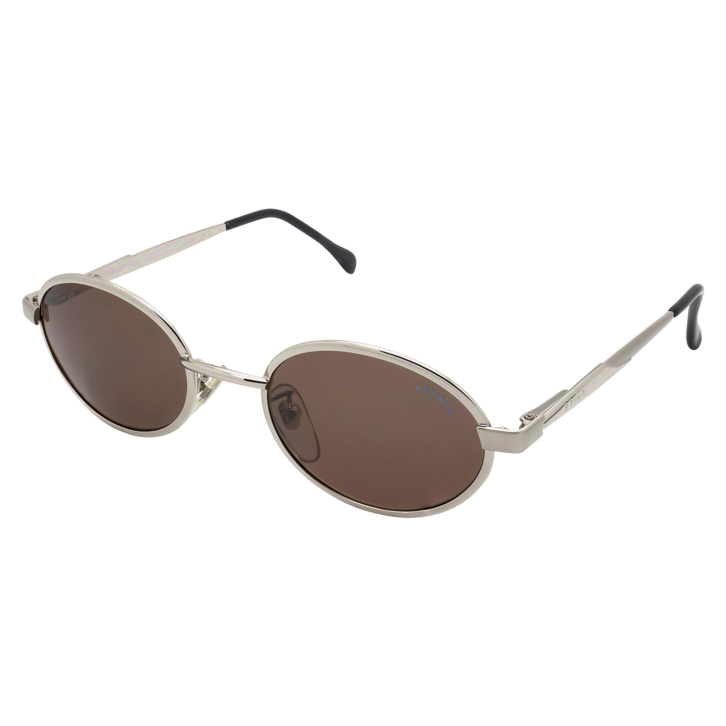 Ovale Vintage-Sonnenbrille mit Riemen und Federscharnieren im Angebot