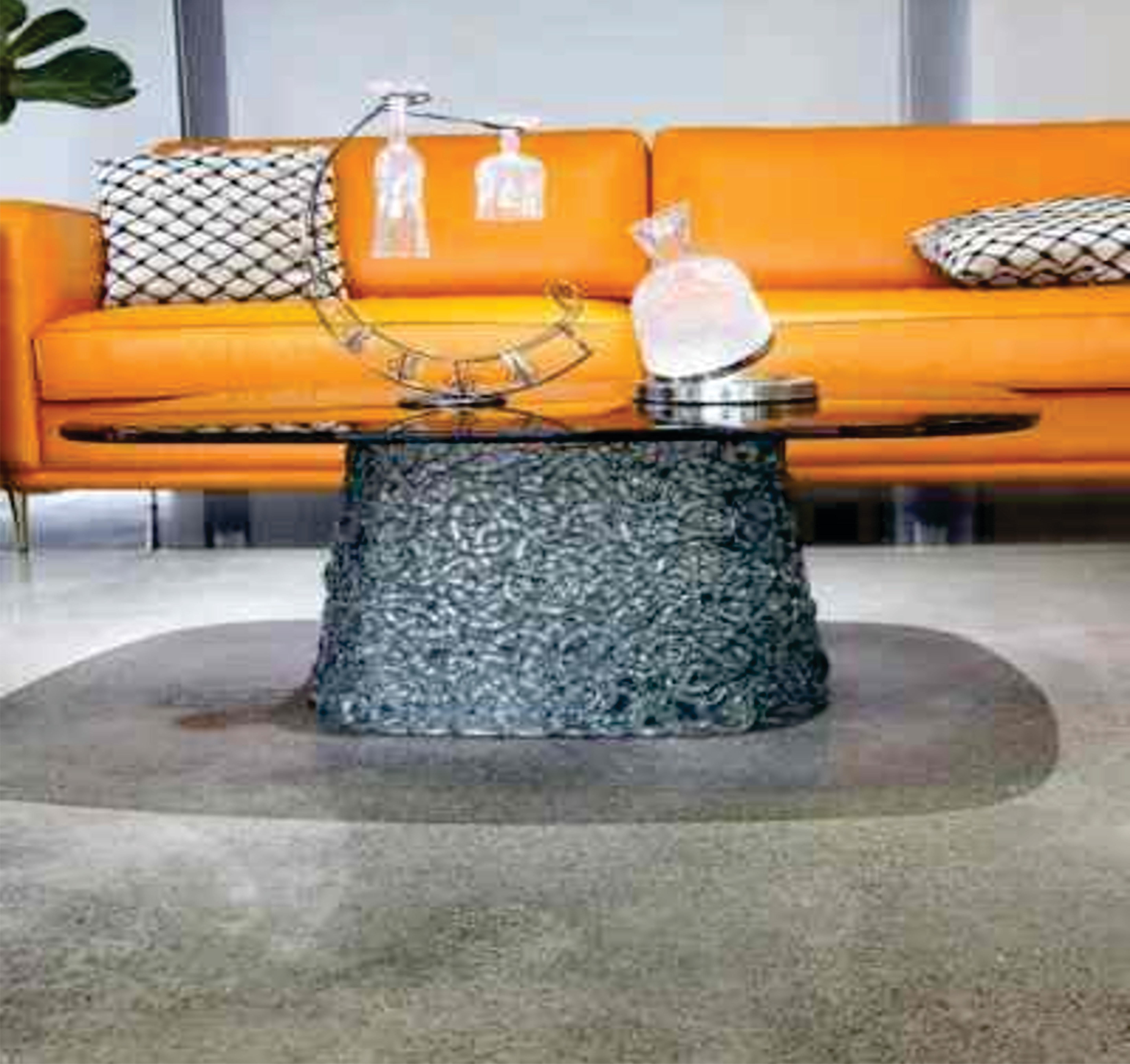 The Stitch Rectangle Coffee Table combines modern elegance with innovative design. Featuring a unique carbonate-stitched base, this table is a functional piece and a bold statement in any living space. Its sleek, contemporary lines and versatile