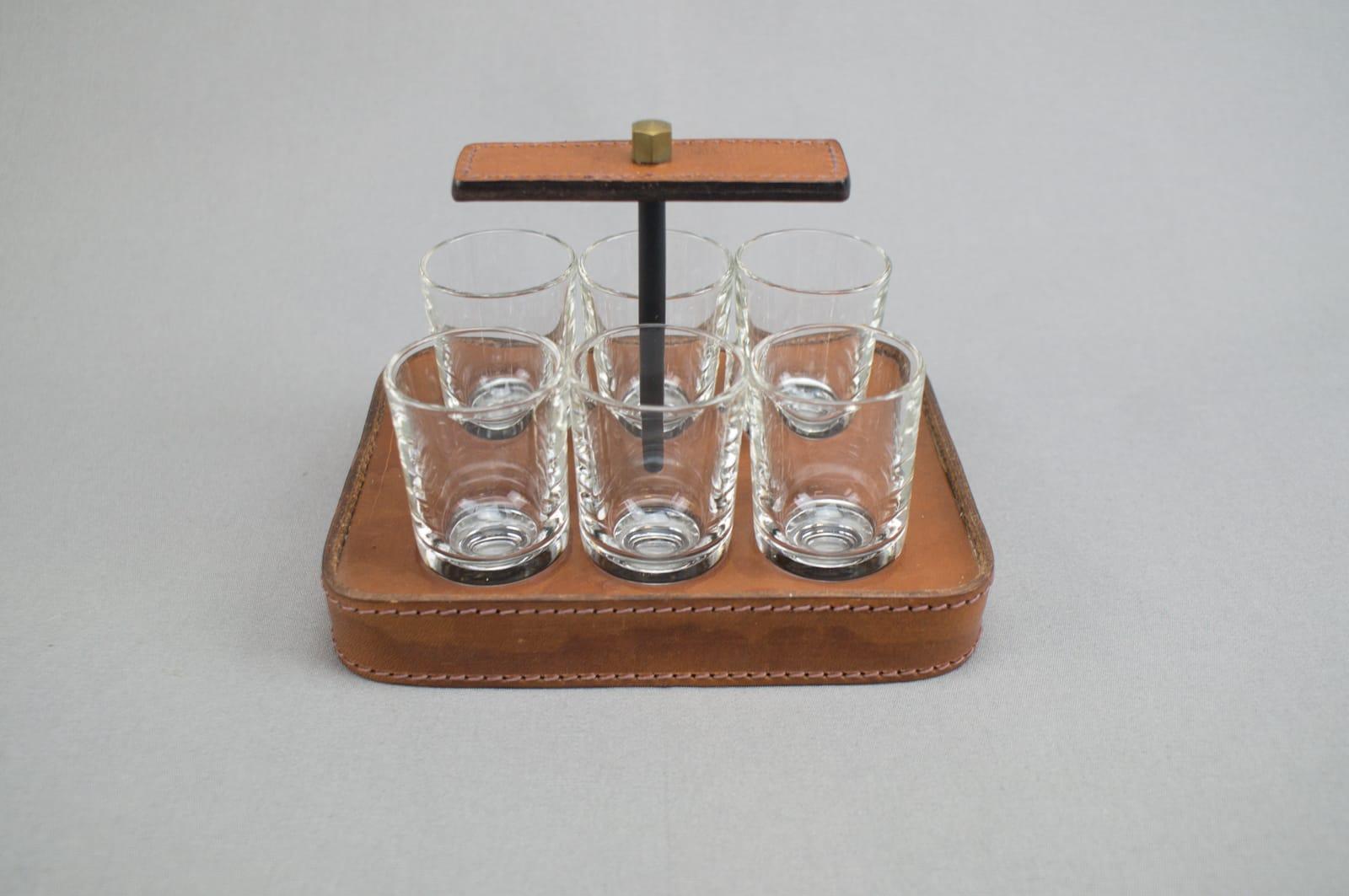 Stitched Adnet attributed table leather schnapps glass holder, France, 1960s. Very good condition.

   