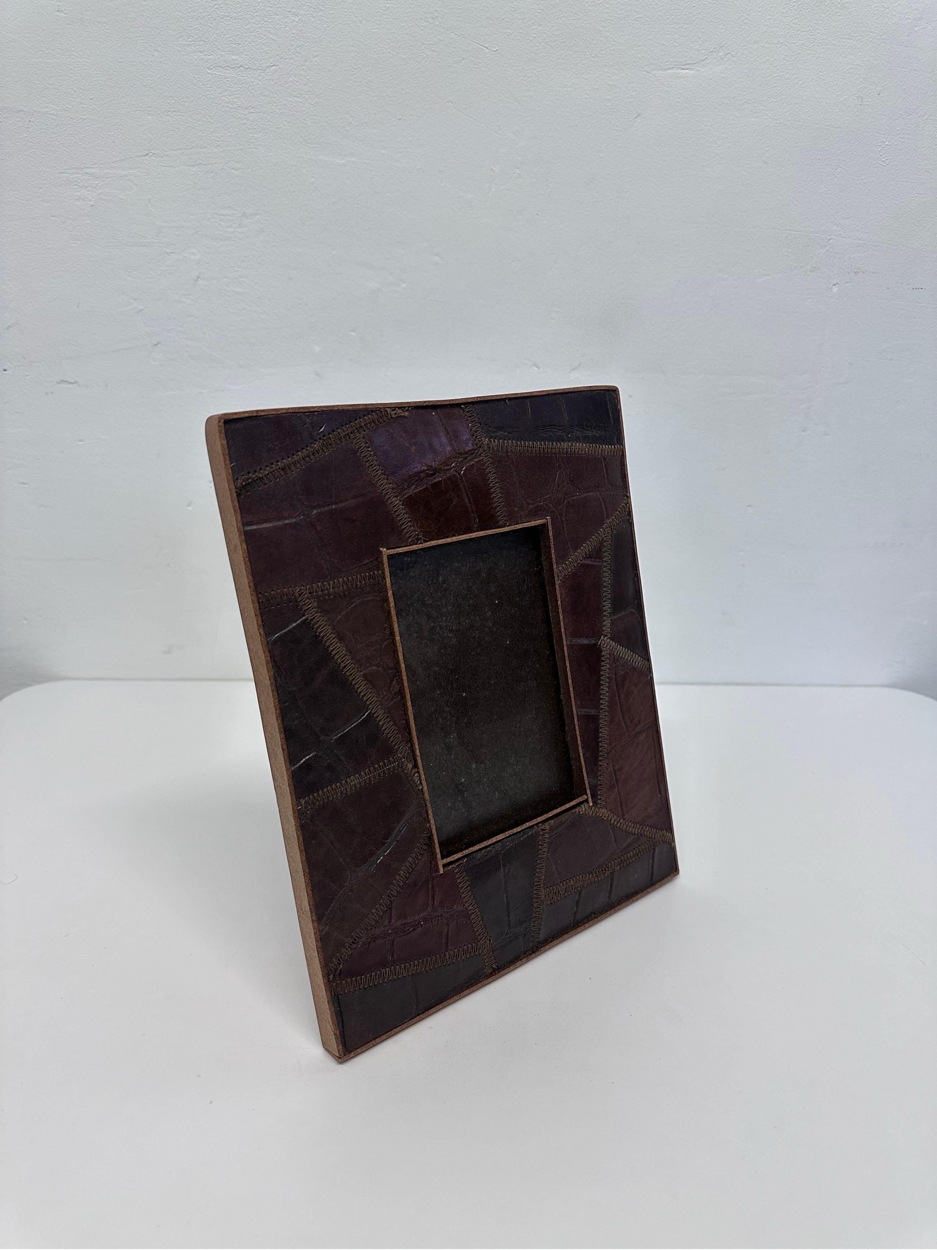 Photo frame covered in stitched alligator embossed leather by Palecek.

Viewable Photo Size: 3-1/2