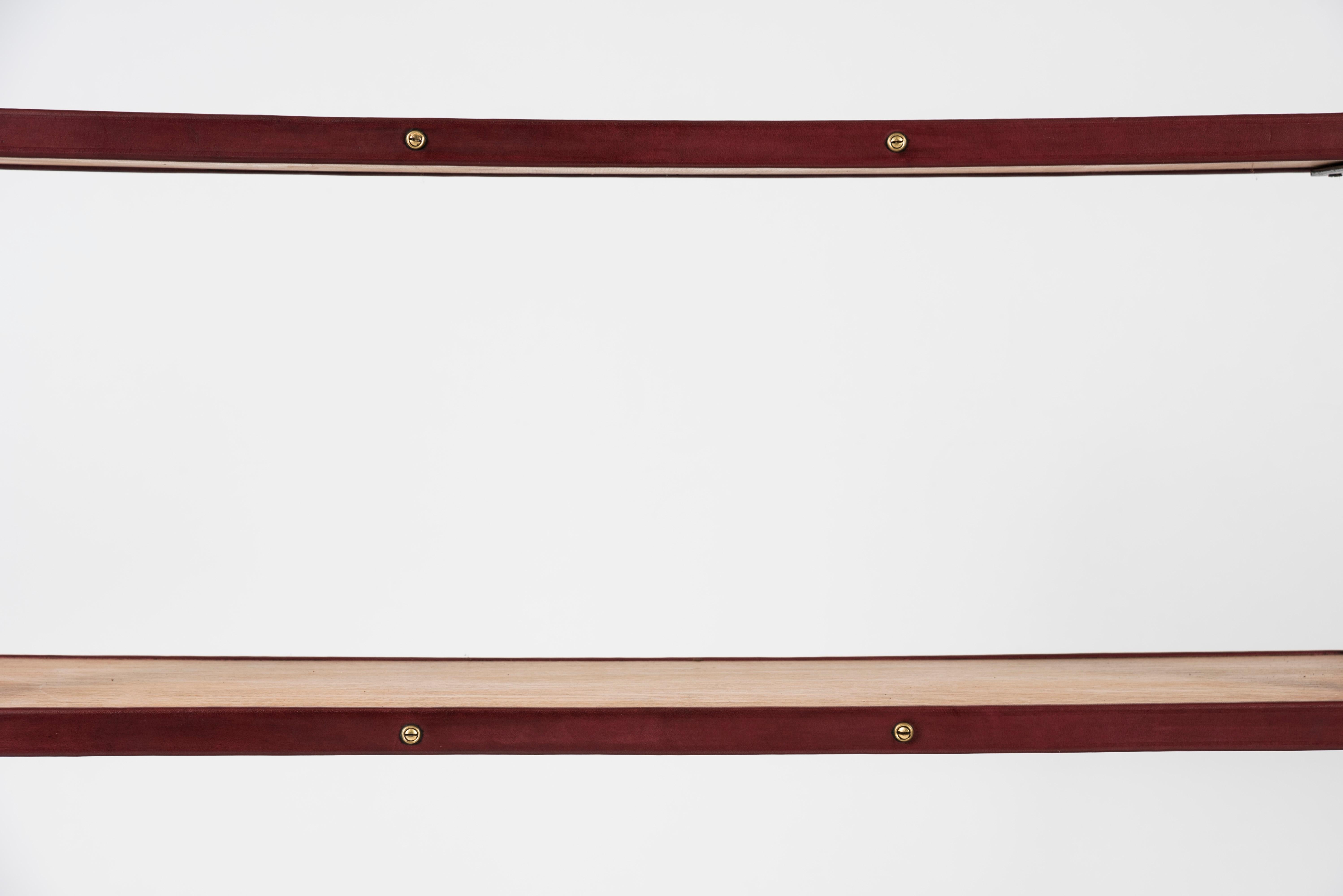 Stitched leather bookrack by Jacques Adnet
Oak and leather.