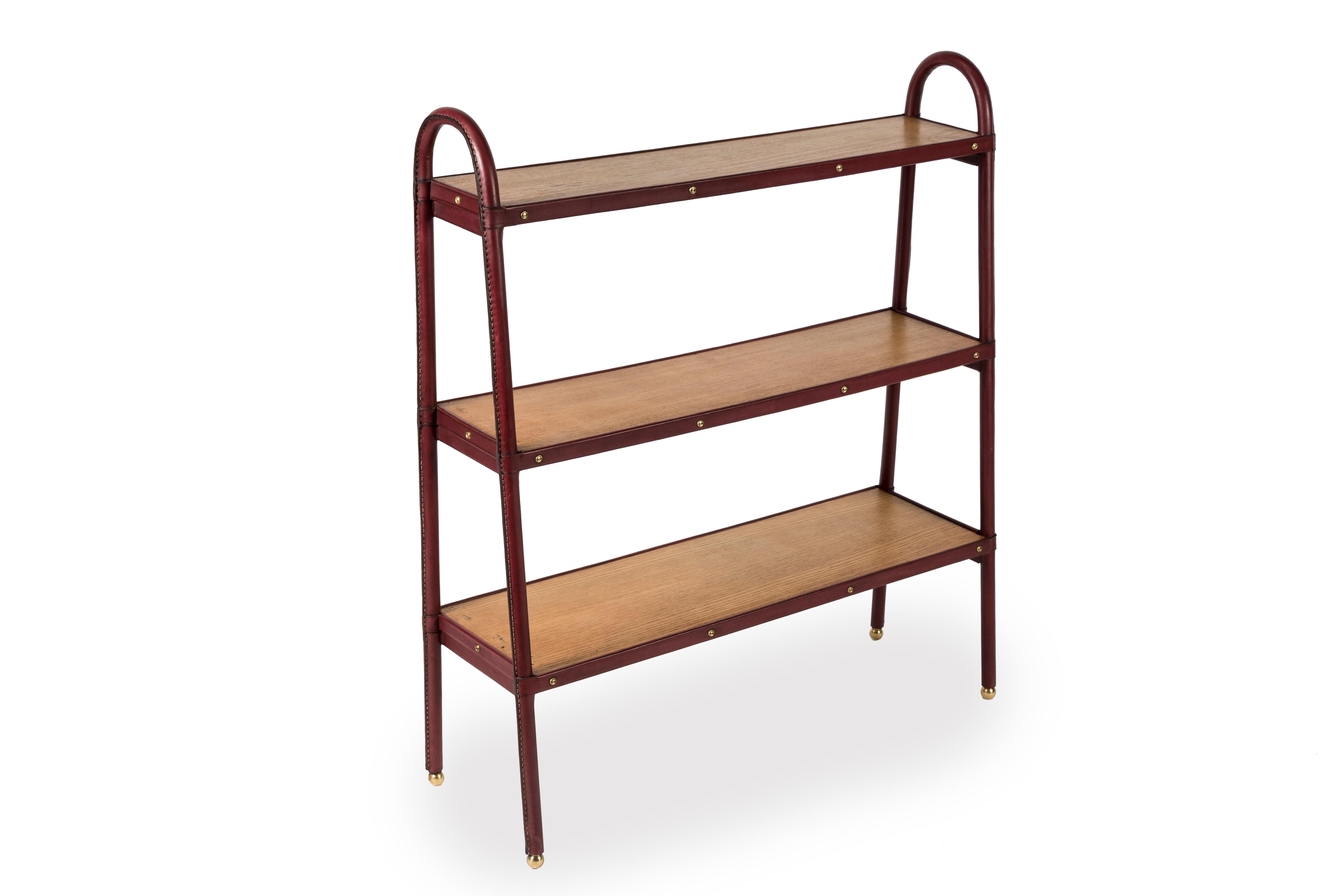 European Stitched leather Bookrack by Jacques Adnet