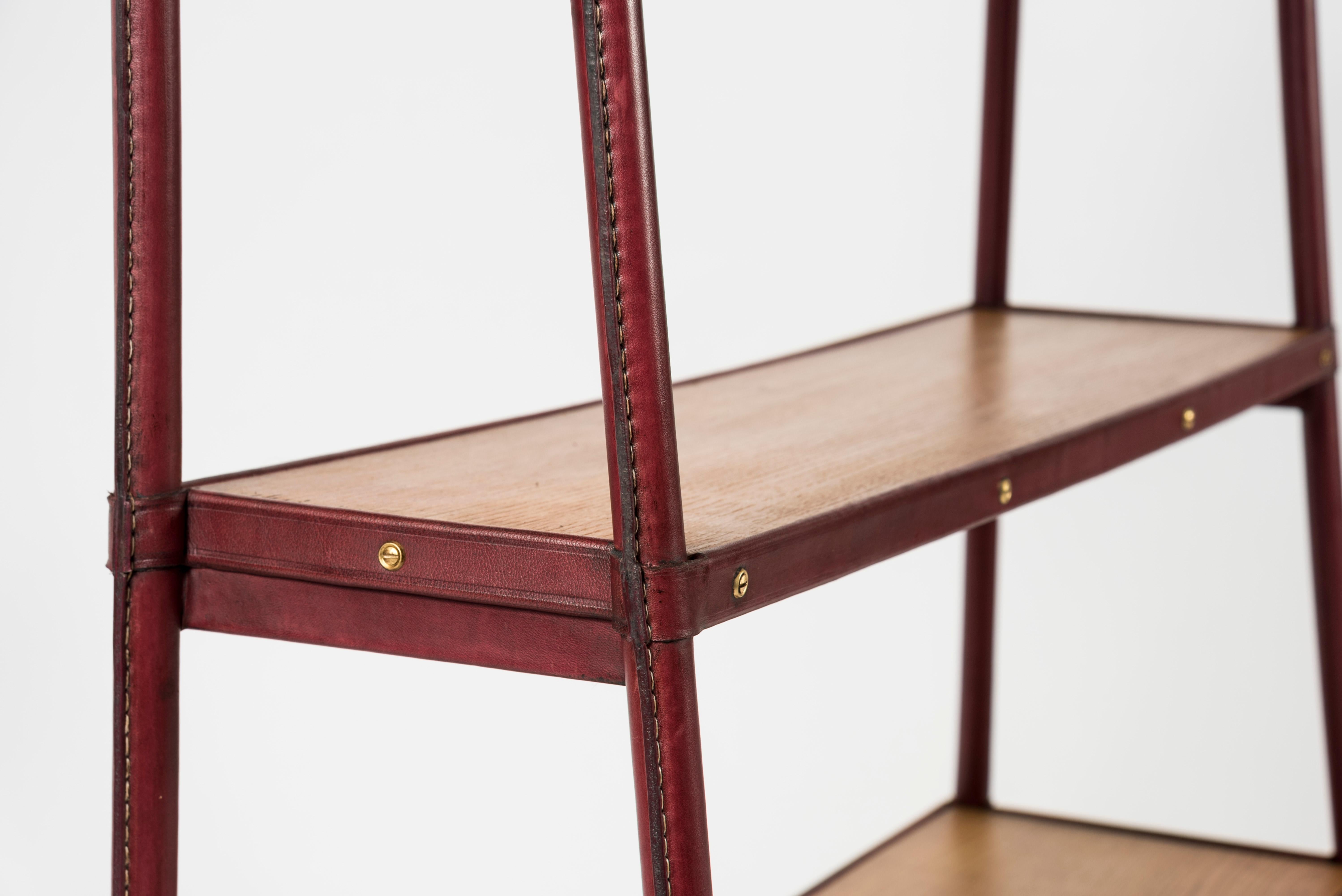 Mid-20th Century Stitched leather Bookrack by Jacques Adnet