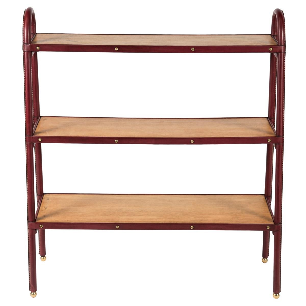 Stitched leather Bookrack by Jacques Adnet