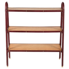 Stitched leather Bookrack by Jacques Adnet