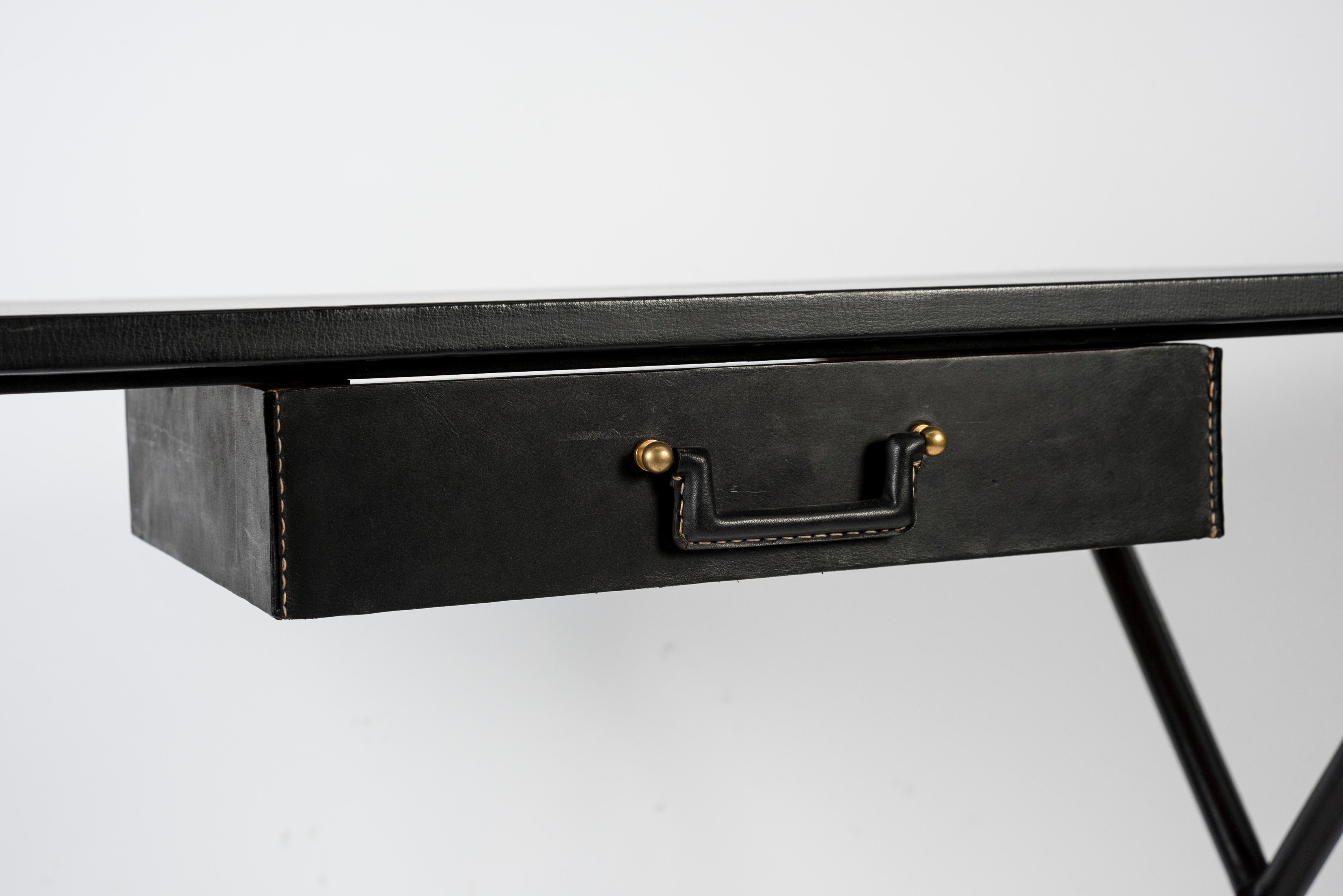 Black stitched leather desk by Jacques Adnet
France
1950s.