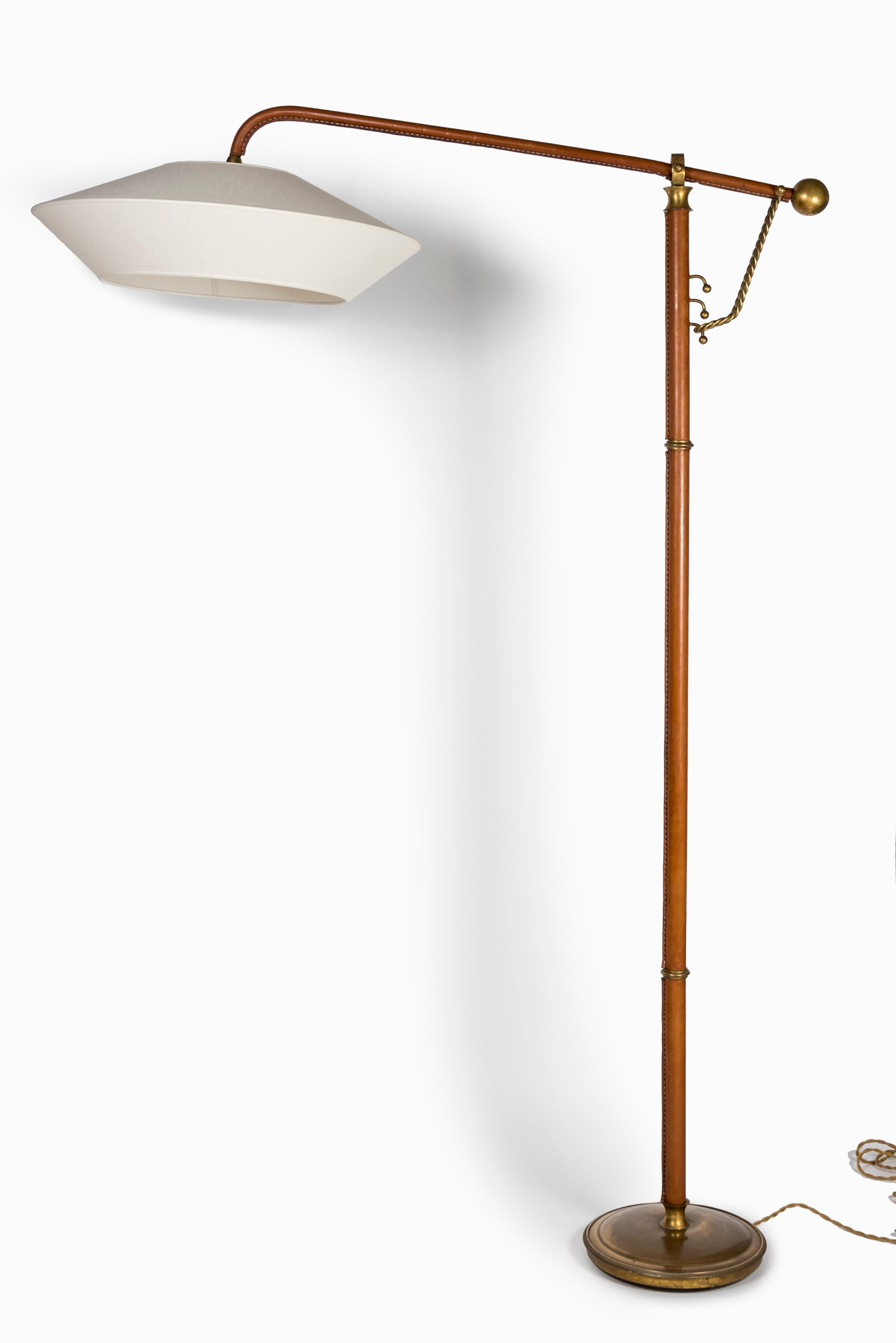 Very unusual stitched leather floor lamp by Jacques Adnet probably a collaboration with Gilbert Poillerat.
 