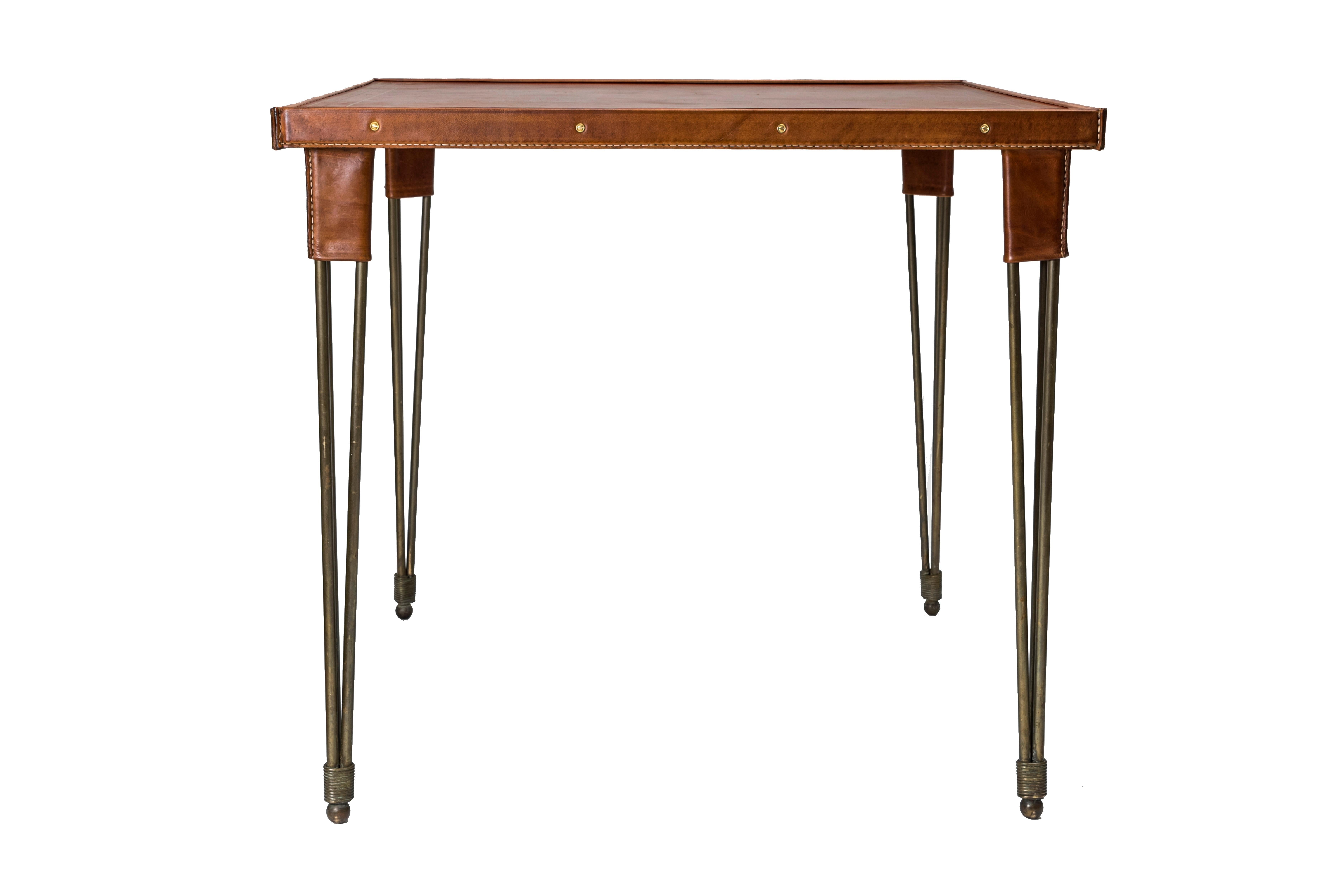 Rare stitched leather game table by Jacques Adnet.