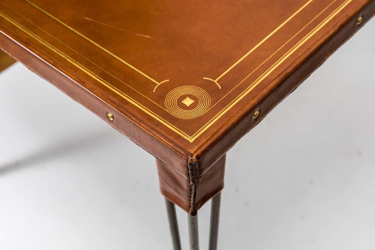 Mid-Century Modern Stitched Leather Game Table with Embossed Motifs and Metal Legs by Jacques Adnet