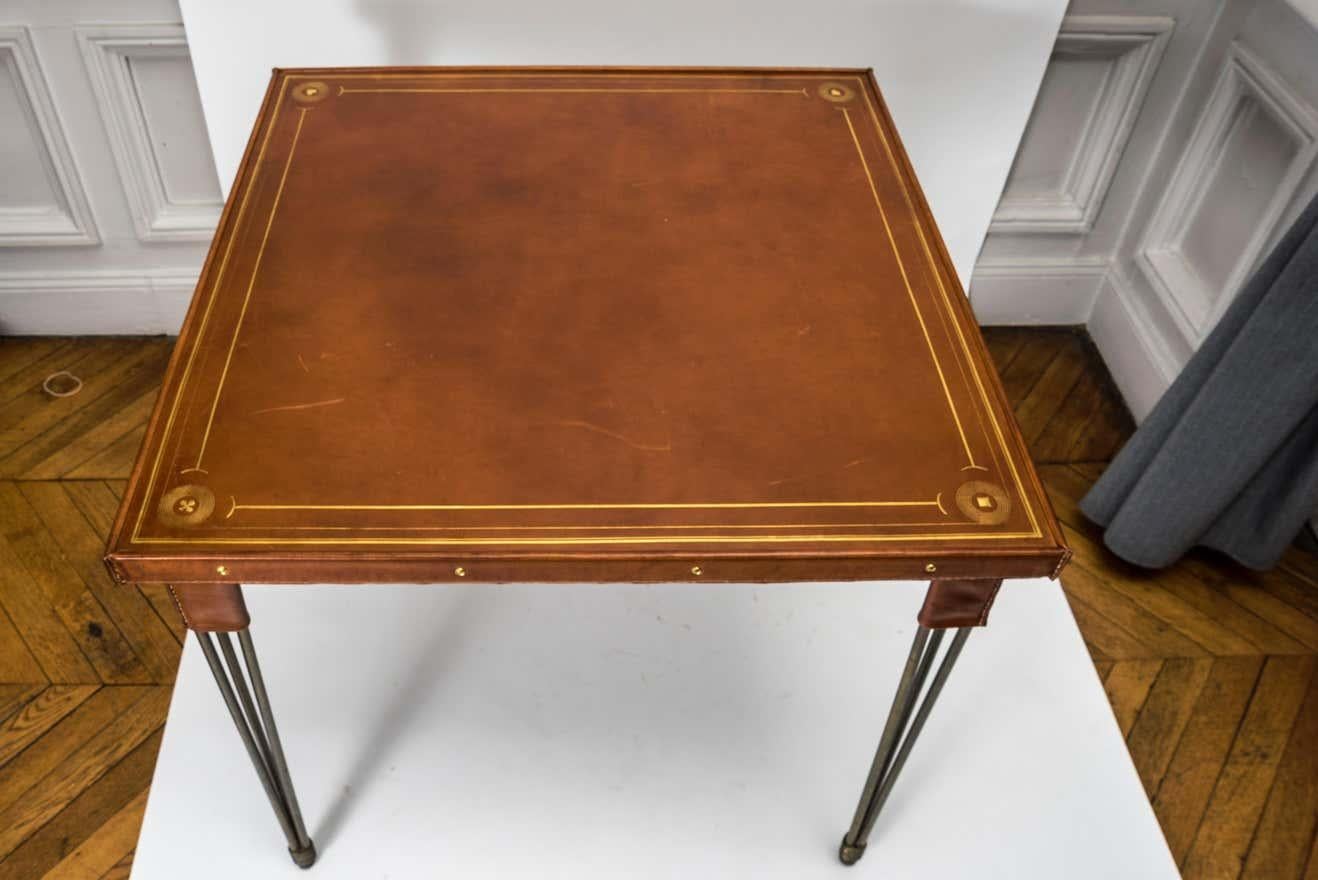 French Stitched Leather Game Table with Embossed Motifs and Metal Legs by Jacques Adnet