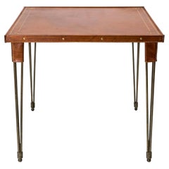 Stitched Leather Game Table with Embossed Motifs and Metal Legs by Jacques Adnet