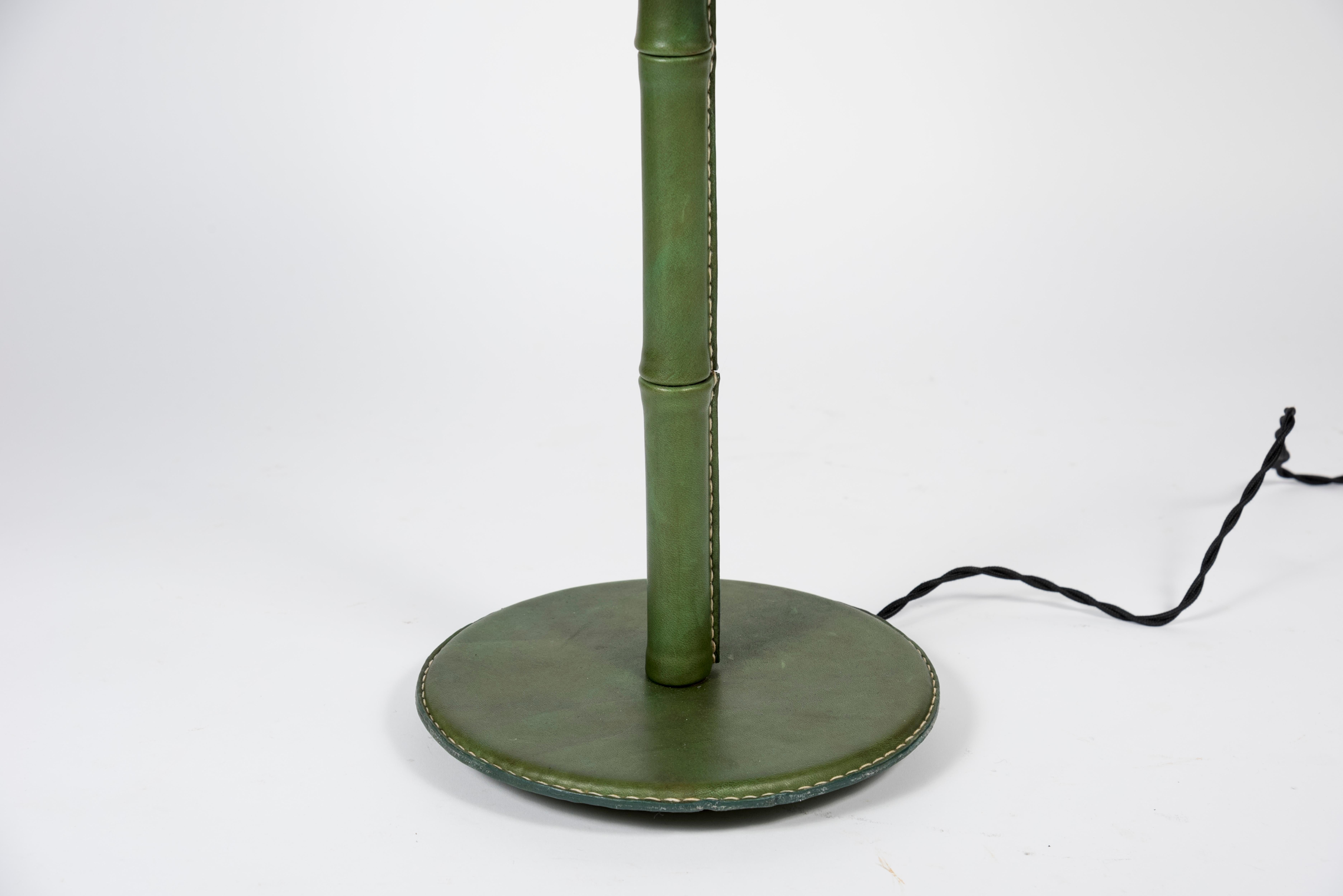 Green stitched leather lamp by Jacques Adnet
Dimensions given without shade
No shade provided.