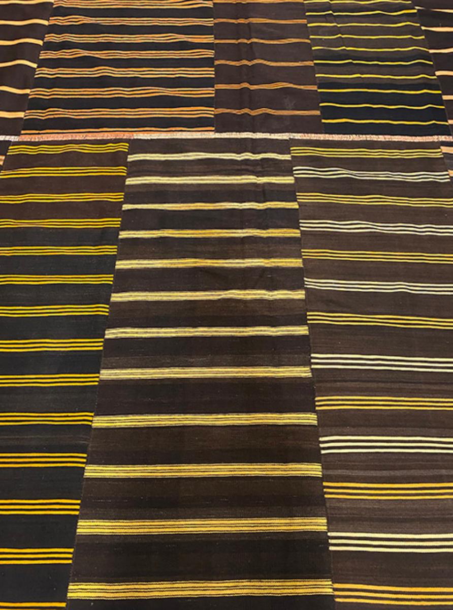 Handsome, casual, unexpected. Striped kilims stitched together and backed.

Origin: Turkey
Dimensions: 11' x 11’8?
Age: 2000’s
Design: Stripe Kilim
Material: 100% Wool Flatweave
Color: Chocolate, yellow, orange

k6643

The word “kilim” is