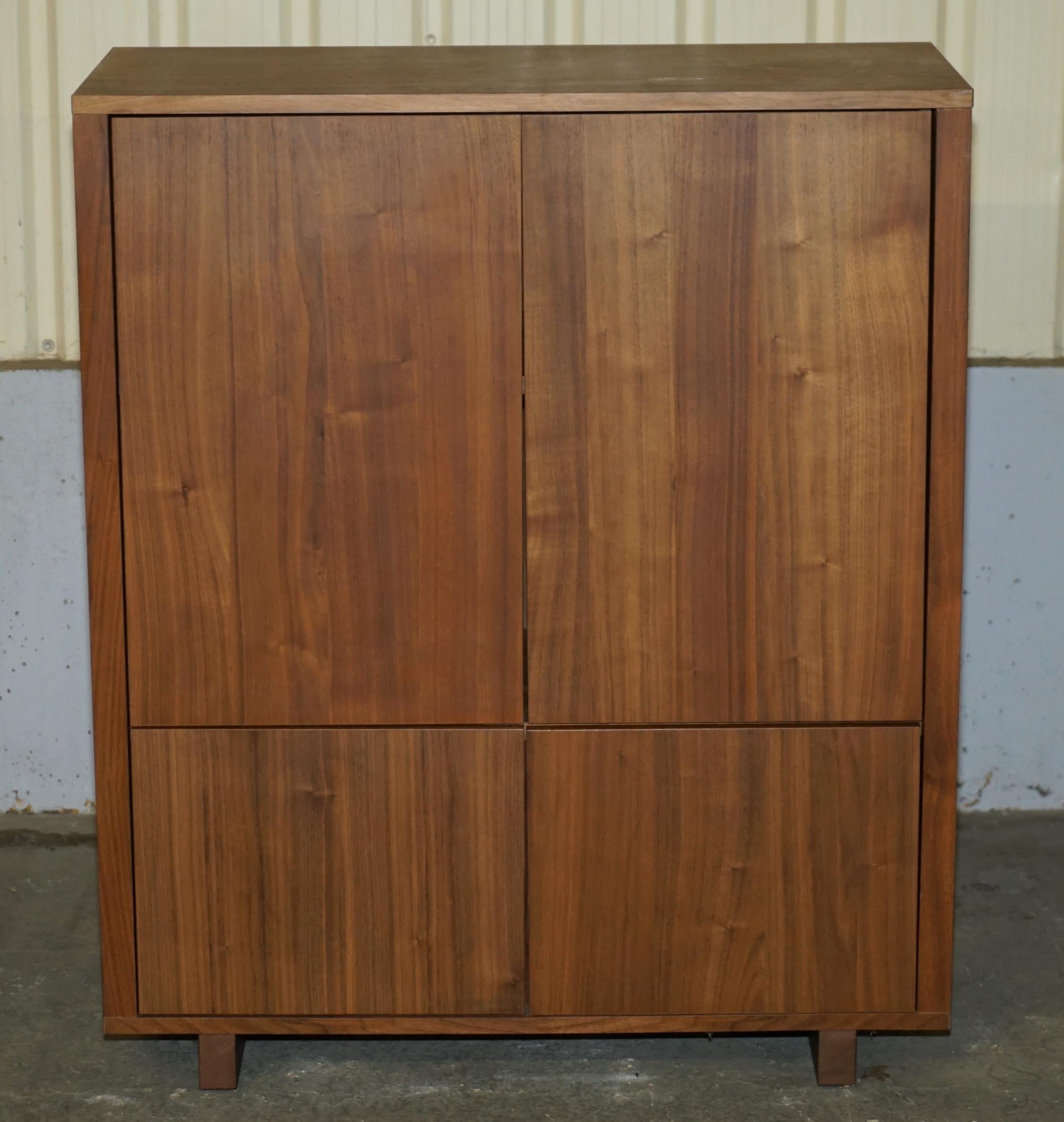 Royal House Antiques

Royal House Antiques is delighted to offer for sale this lovely Stockholm cabinet in Walnut finish with twin drawers and cupboards 

Please note the delivery fee listed is just a guide, it covers within the M25 only for the UK
