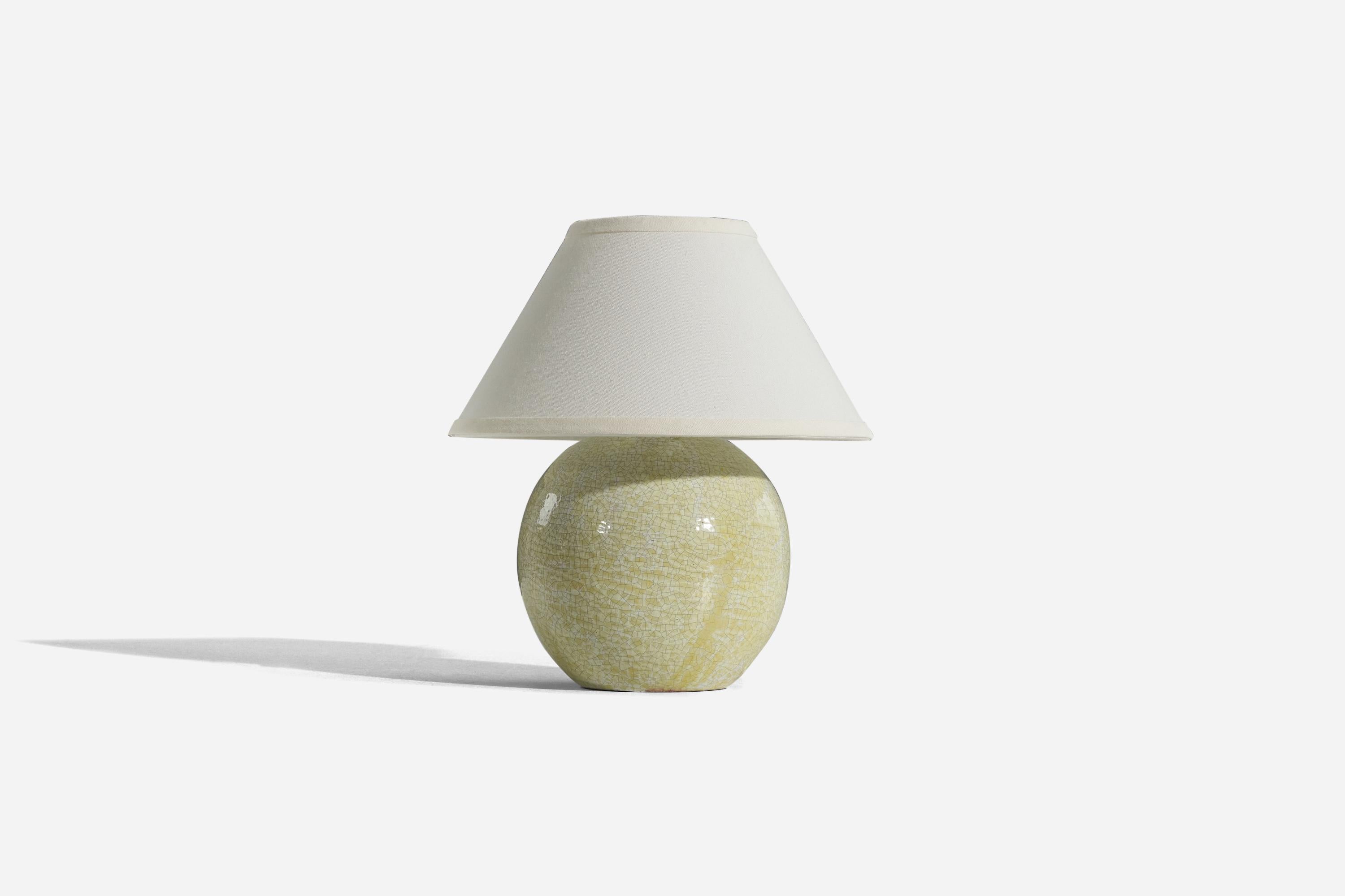 A light green stoneware table lamp designed and produced by Stockholms Keramik, Sweden, c. 1930s. 

Sold without lampshade. 
Dimensions of Lamp (inches) : 10.37 x 7.93 x 7.93 (H x W x D)
Dimensions of Shade (inches) : 5.25 x 12.25 x 7.25 (T x B