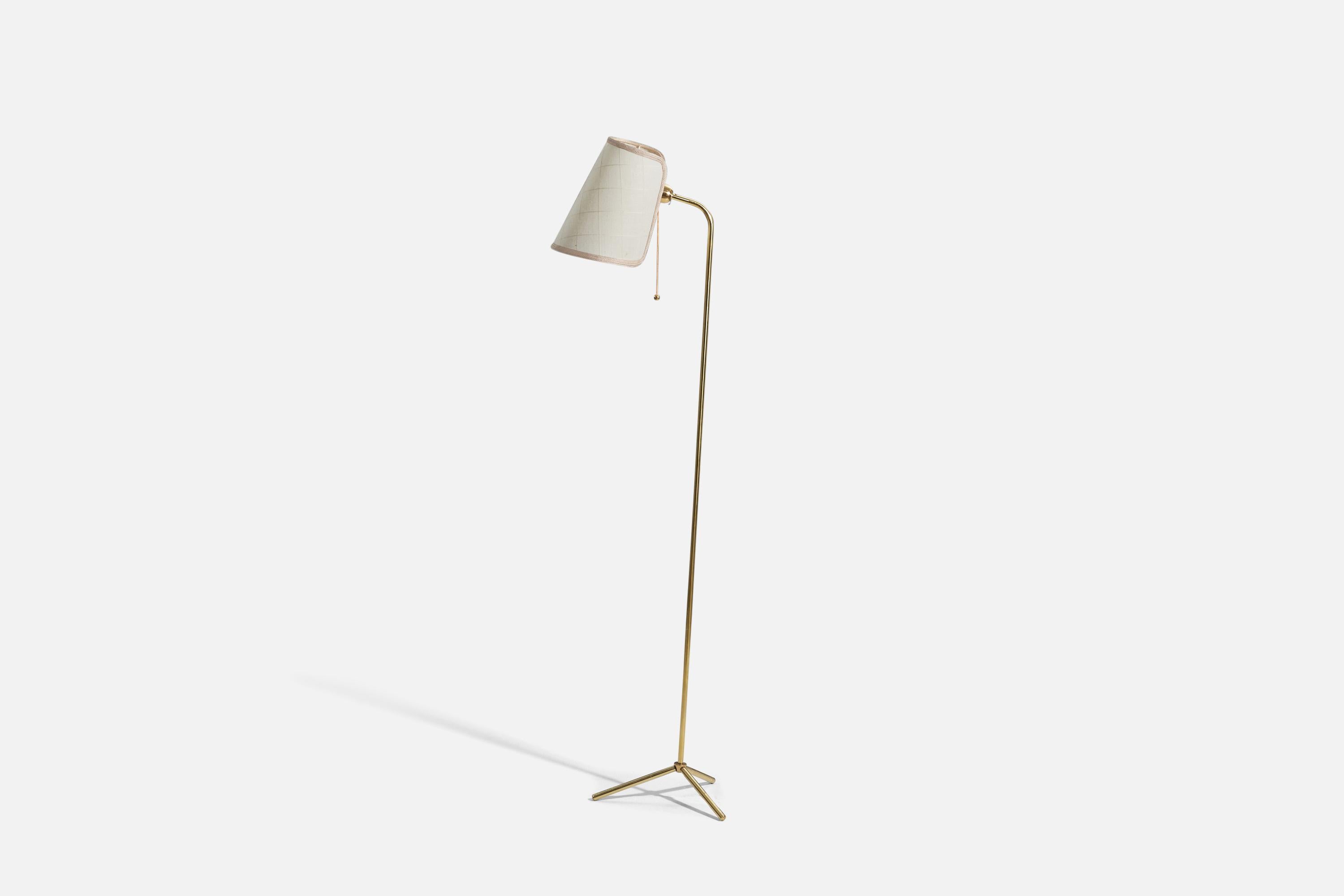 An adjustable, brass and white fabric floor lamp designed by a Finnish designer and produced by Oy Stockmann-Ornö AB, Finland, c. 1950s. 

 