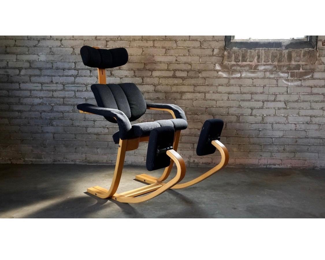 Whether you are working at a computer or want to take a snooze, this chair is the right chair. It looks like a piece of art and features three separate seating experiences. Age appropriate wear including some
pilling on fabric. Features bentwood