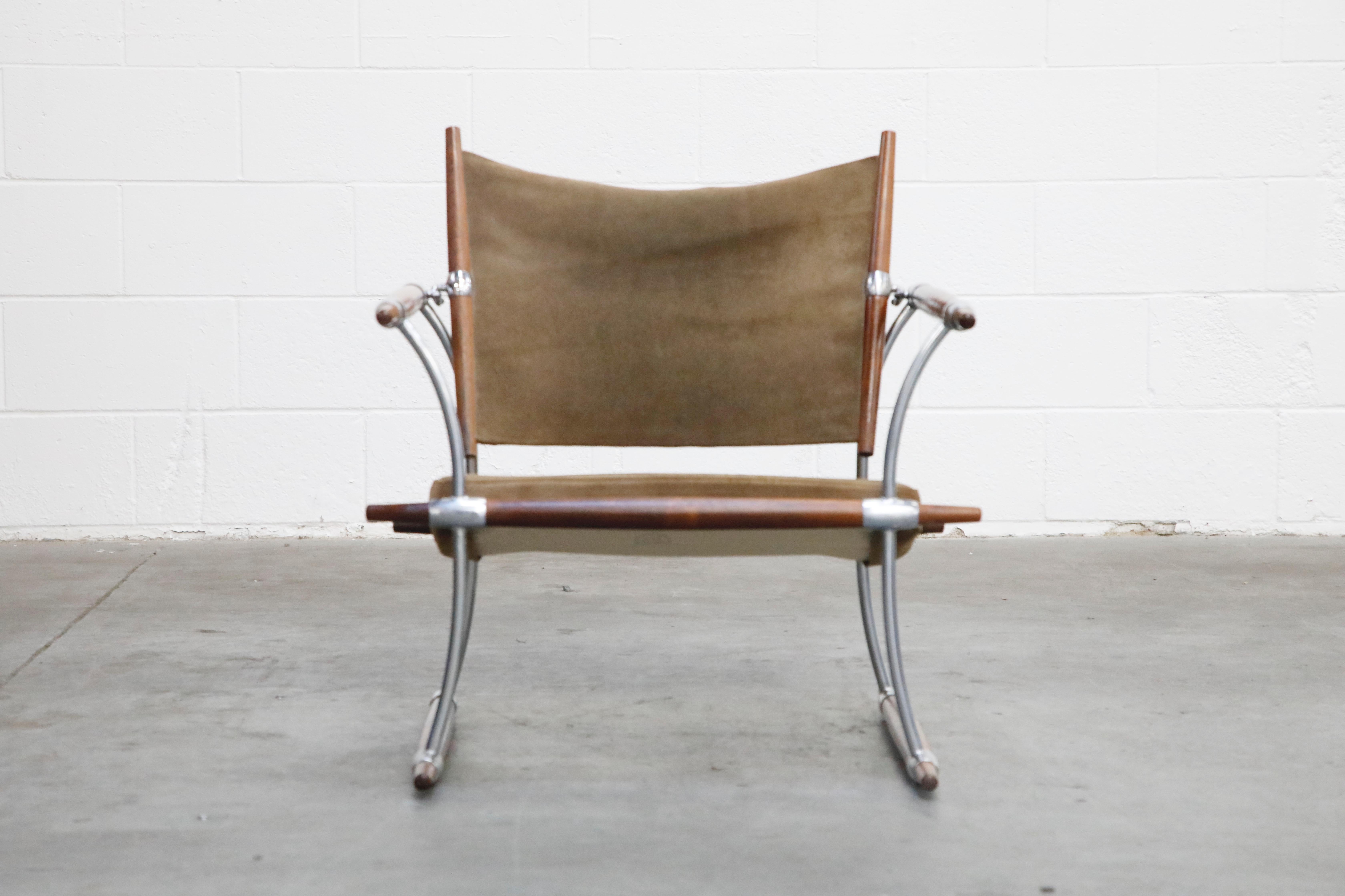 This sleek collectors item is the 'Stokke' lounge chair by Jens Harald Quistgaard for Nissen Langaa, Denmark, designed and produced in the 1960s. The 'Stokke' chair features Rosewood rails held together with chrome plated steel bars and hooks.  The