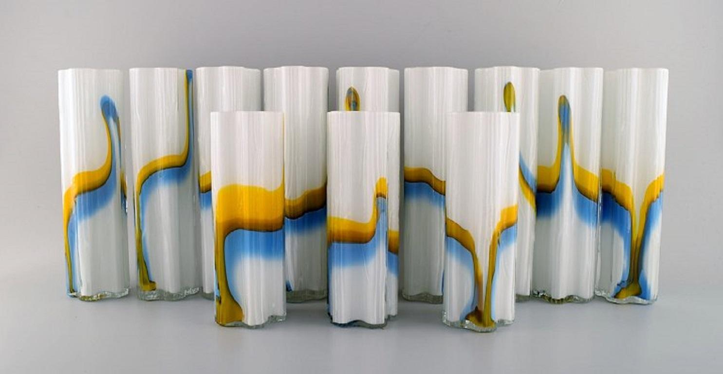 Stölzle-Oberglas, Austria. Twelve Vienna vases in art glass. 1980s.
Largest measures: 25 x 7 cm.
In excellent condition.