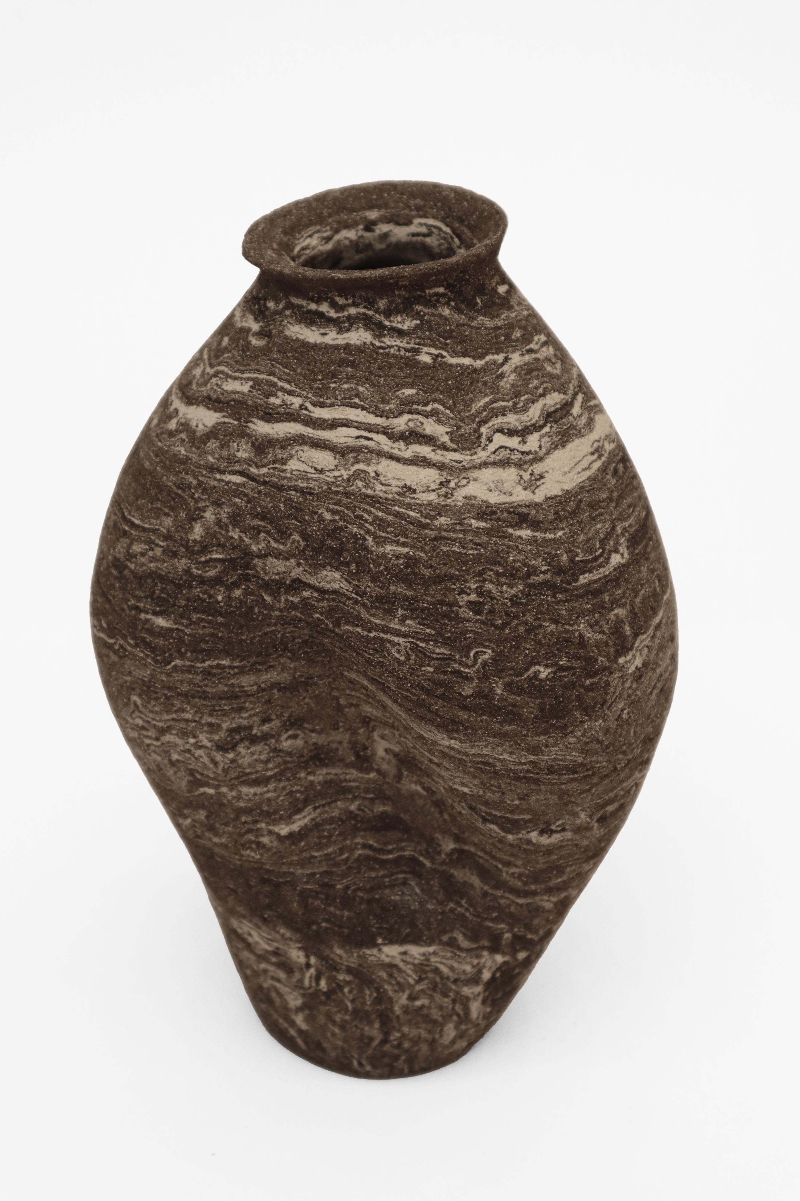 Stomata 1 vase by Anna Karountzou
Dimensions: W 11 x D 10.5 x H 24 cm
Materials: mixed black and white stoneware clay, clear glaze inside, fired at 1240

Born and based in Athens, Greece, with a background in conservation of works of art and
