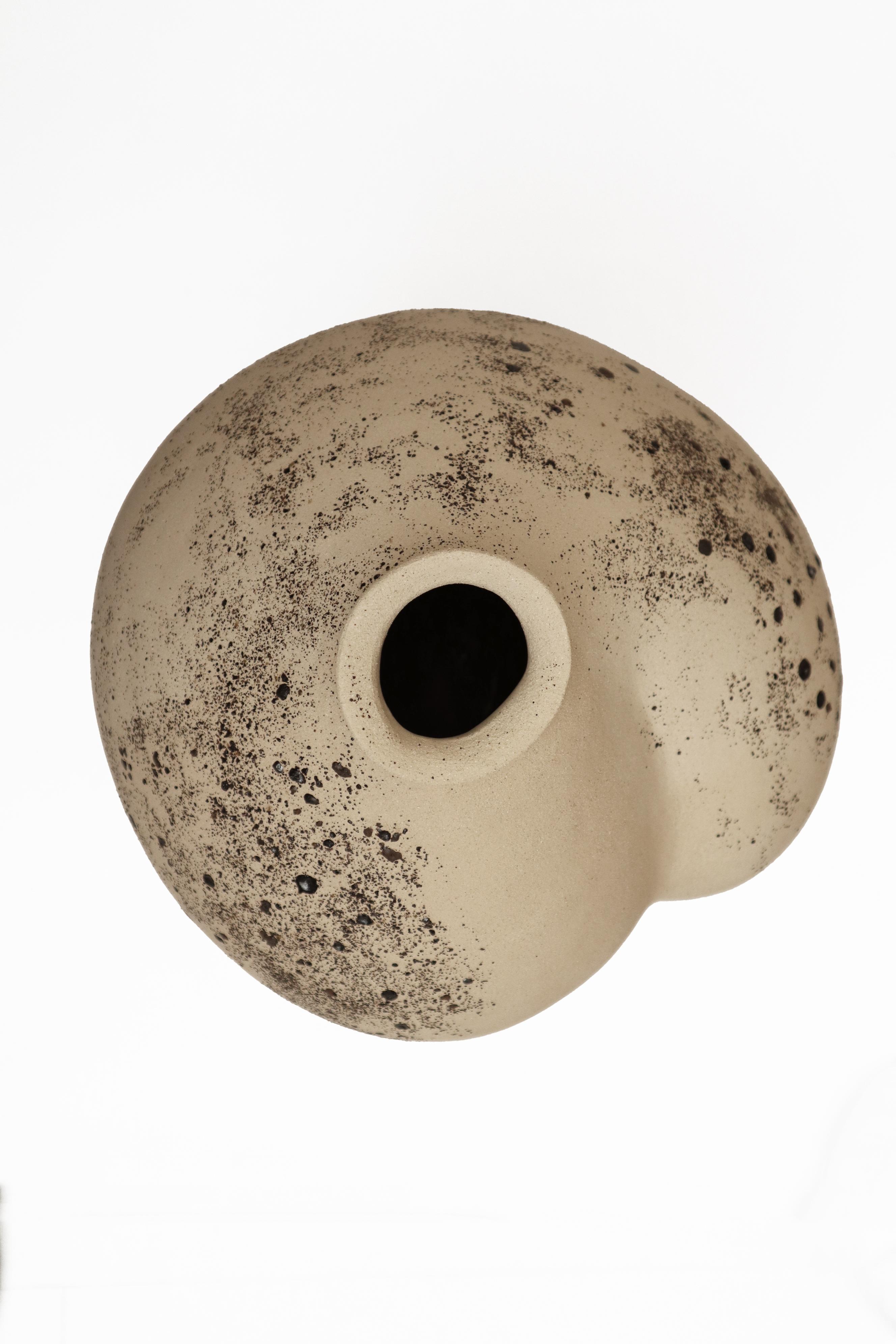 Stomata 13 vase by Anna Karountzou
Dimensions: W 32 x D 31 x H 45 cm
Materials: White stoneware clay, clear glaze inside, decorated outside with volcano rocks collected from Santorini, fired at 1240

Born and based in Athens, Greece, with a