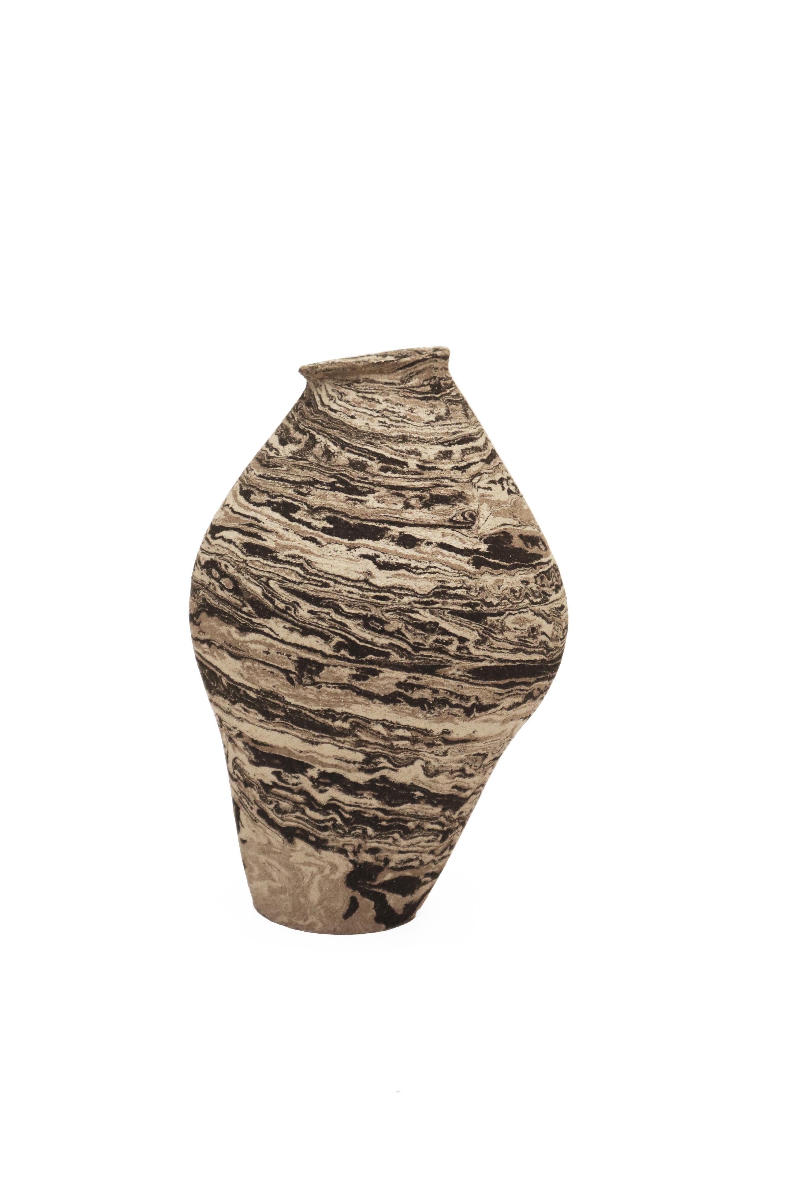 Stomata 9 vase by Anna Karountzou
Dimensions: W 12.5 x D 12.5 x H 23.5 cm
Materials: Mixed black, beige and white stoneware clay, clear glaze inside, fired at 1240

Born and based in Athens, Greece, with a background in conservation of works of