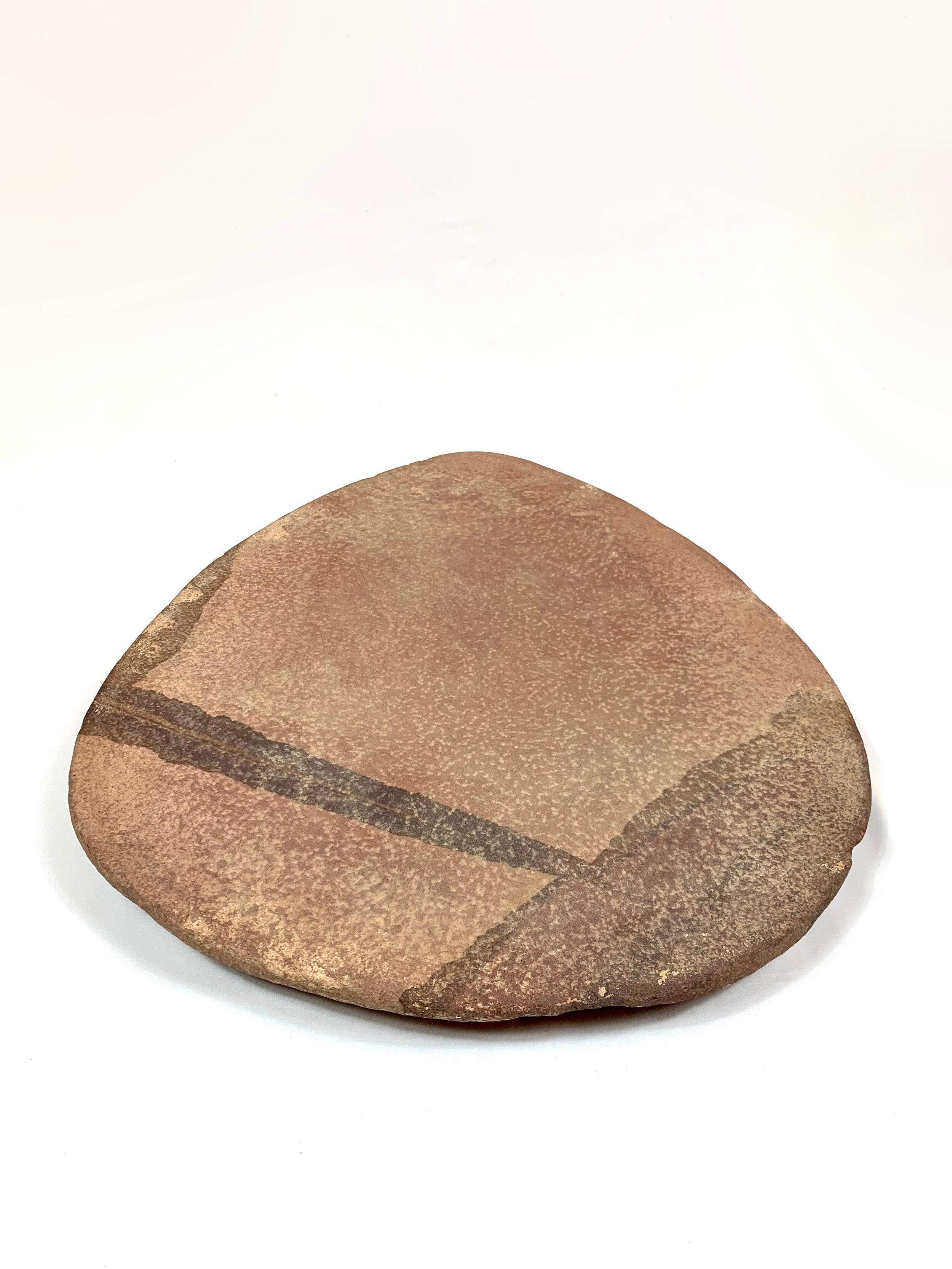 An original, rare and beautifully shaped Neolithic carving plate from Morocco. Perfect for a unique table setting.

Approximately 10,000 years old and in excellent condition.

Dimensions: 55 x 30 x 5 cm.