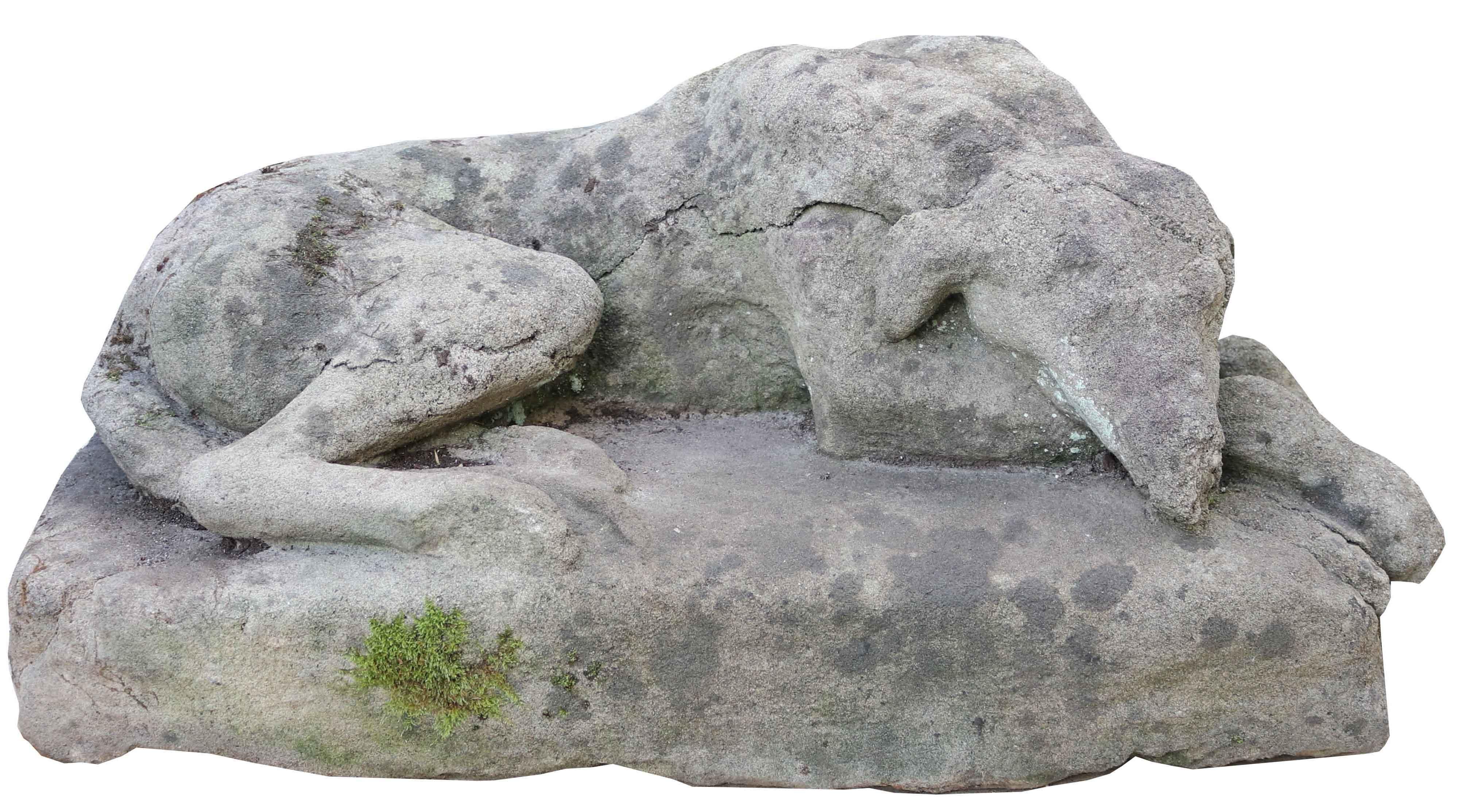 A garden statue of a resting Greyhound, in the manner of Austin and Seeley.