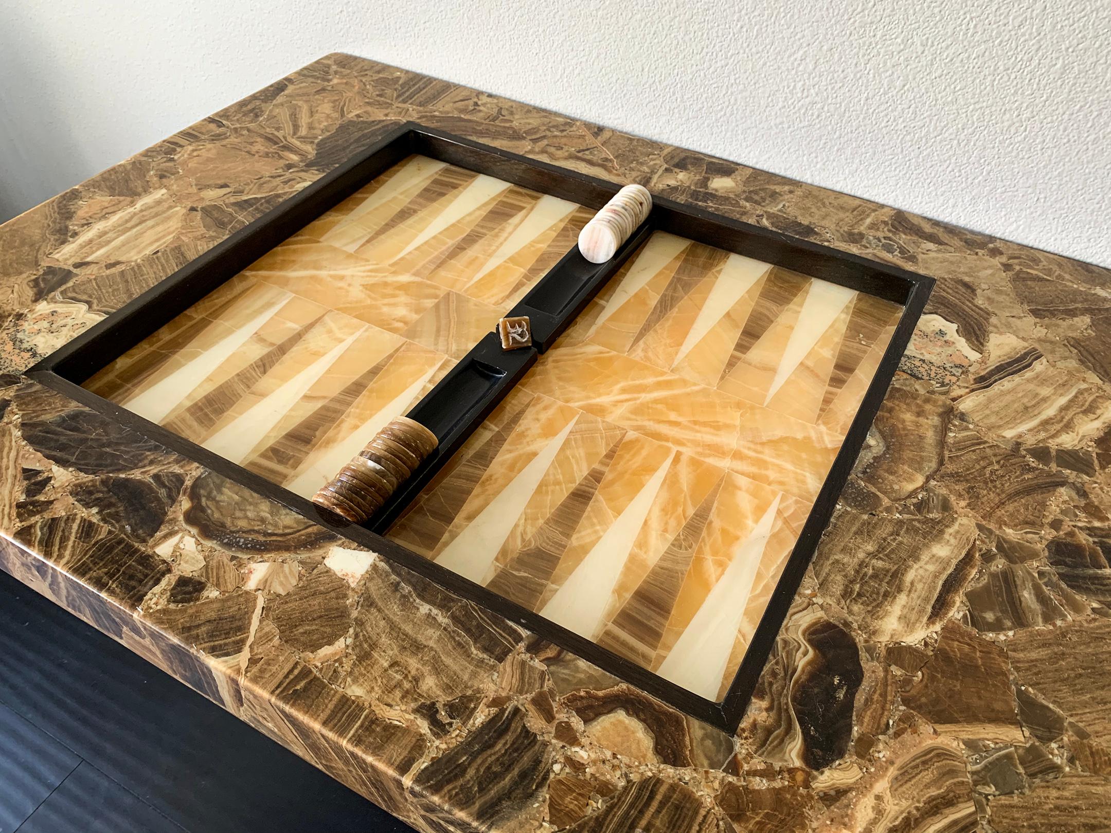 This stone backgammon table is absolutely stunning! With an inlay stone top, stone pieces and doubling cube, this piece almost has a brutalist feel. A super chic, midcentury game table.