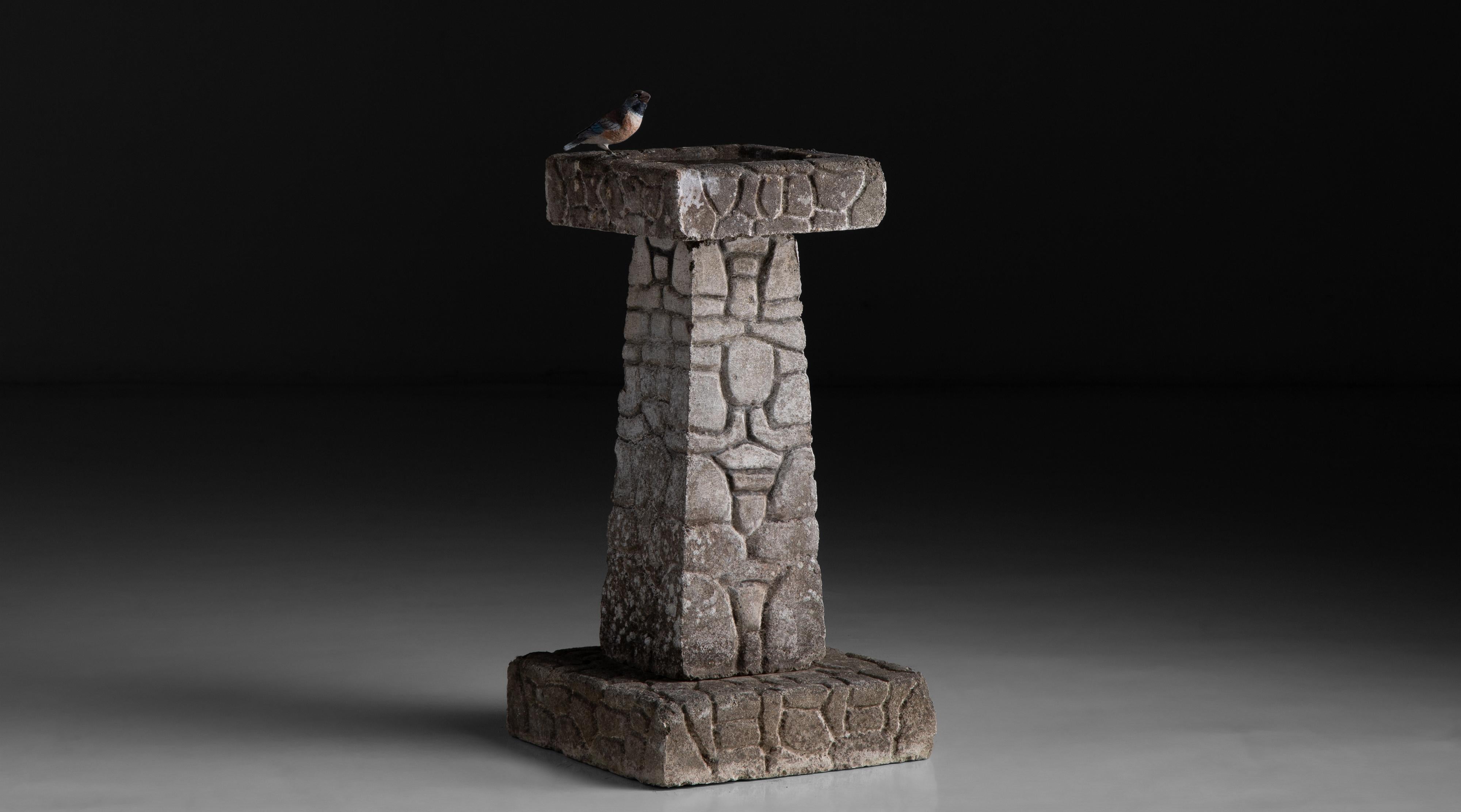 Stone Bird Bath, England circa 1950

Composite stone bird bath with faux stone work aesthetic

Measures 13.75”W x 13.5”D x 26”H.