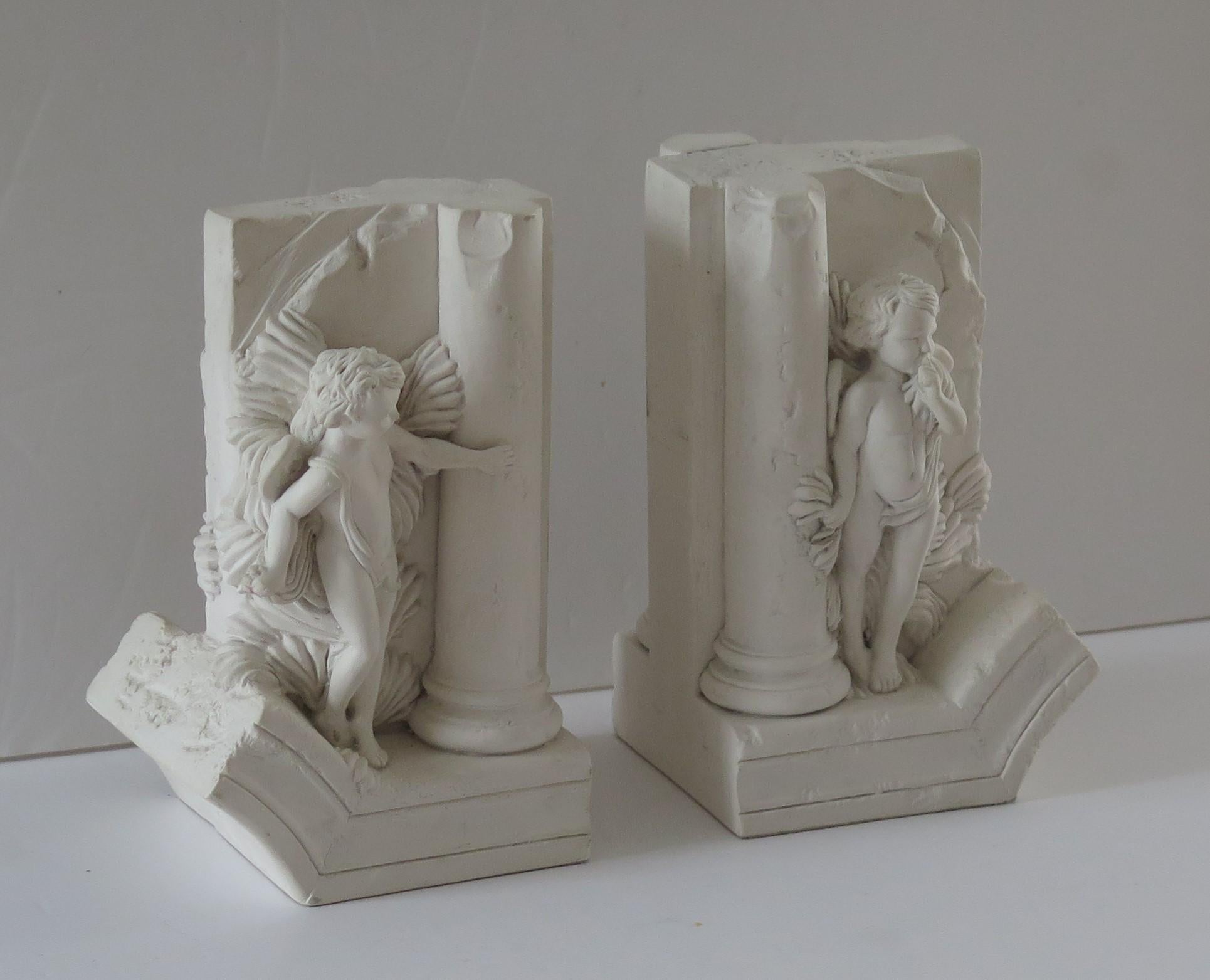 These are a beautiful pair of cherub Bookends made by the Revival Art Company of Birmingham, UK in the late 20th Century

These bookends are inspired from a J B Carpeaux sculpture on the Paris Opera House. They feature two cherubs playing playing