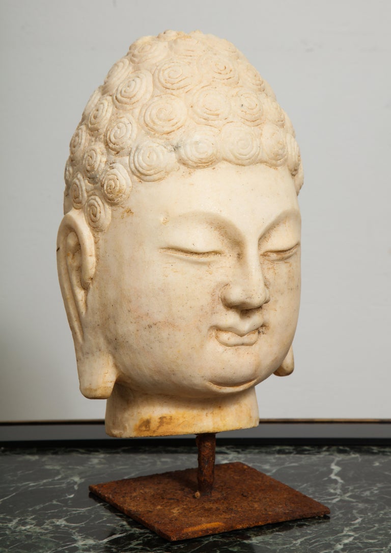 Stone Buddha bust.