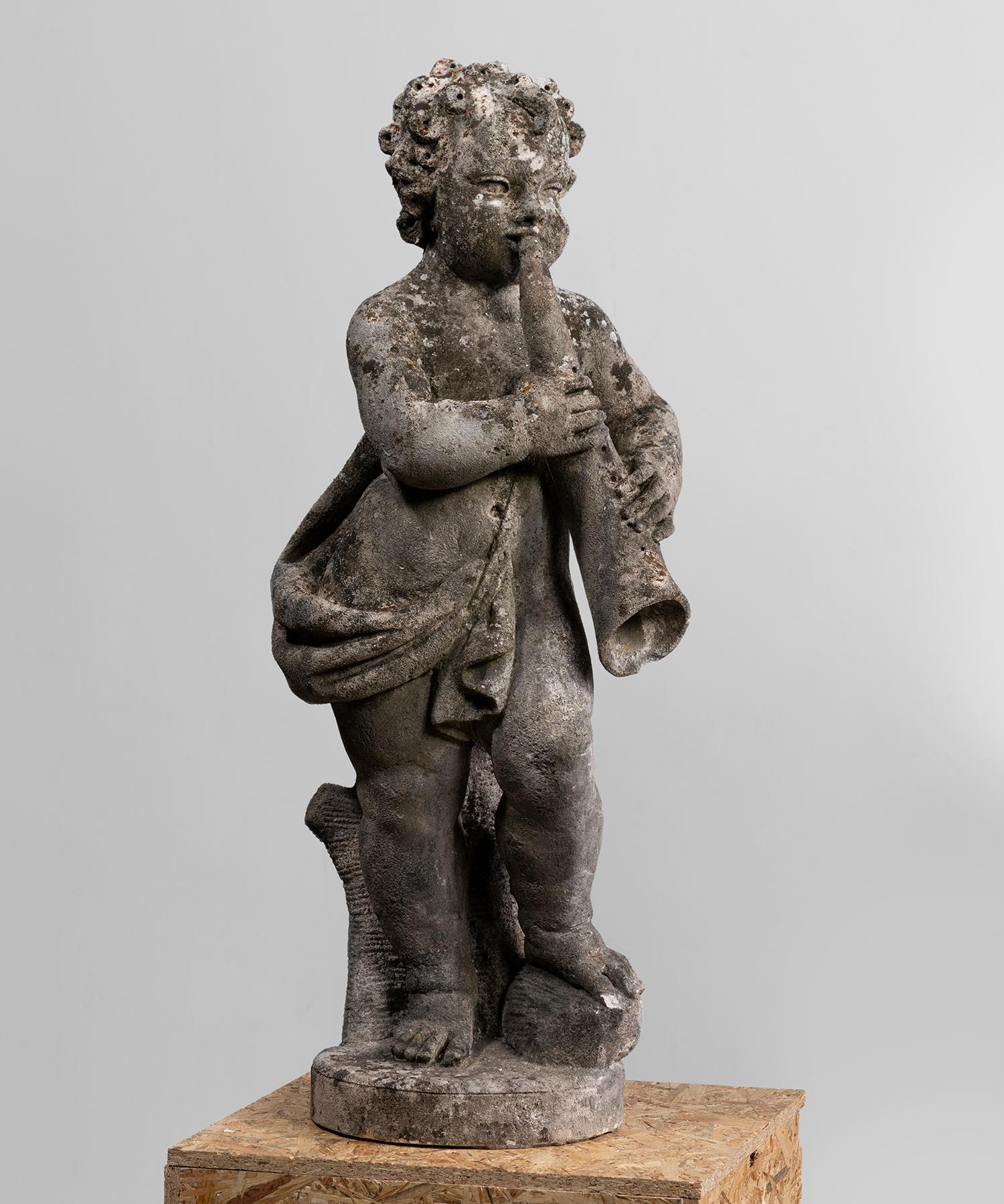 Cast stone garden statue of cherub with horn. wonderful patina