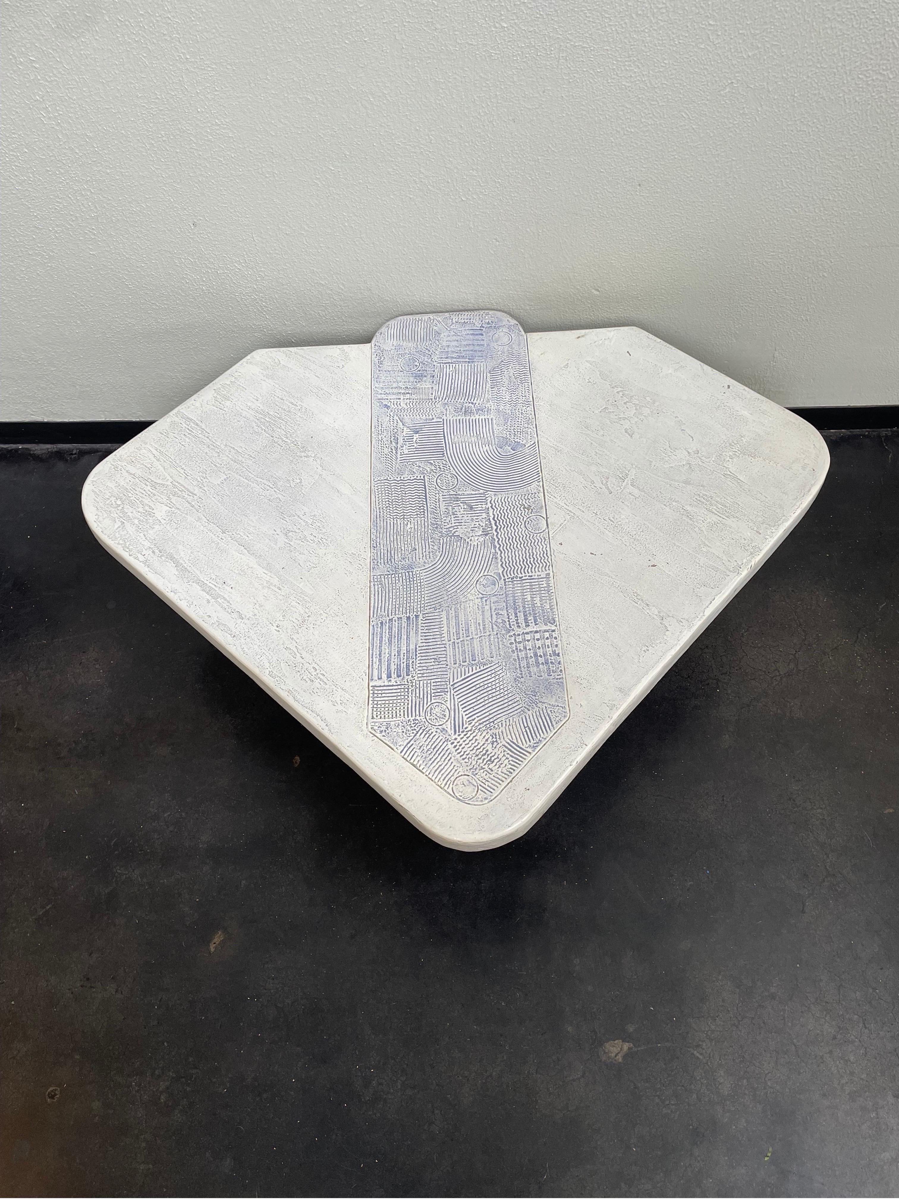 Vintage stone composite coffee table with beautiful tribal inspired markings with artist signature.