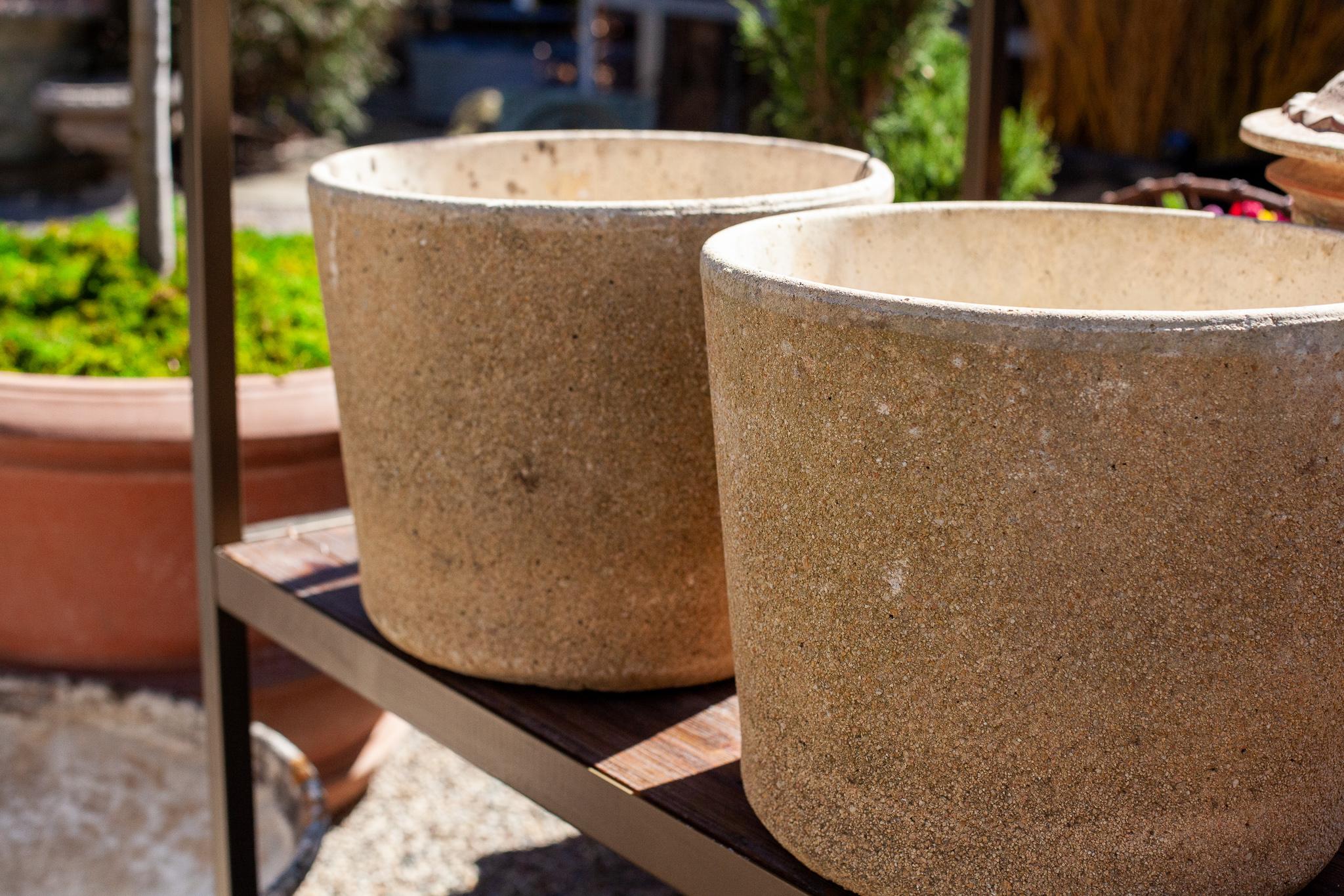 Fleurdetroit presents this pair of composite-stone planters for your consideration. 

Marked by the hands of time, the patina on these vintage, composite stone, garden planters adds to their sleek and modern feel. Perfectly suited for a place of