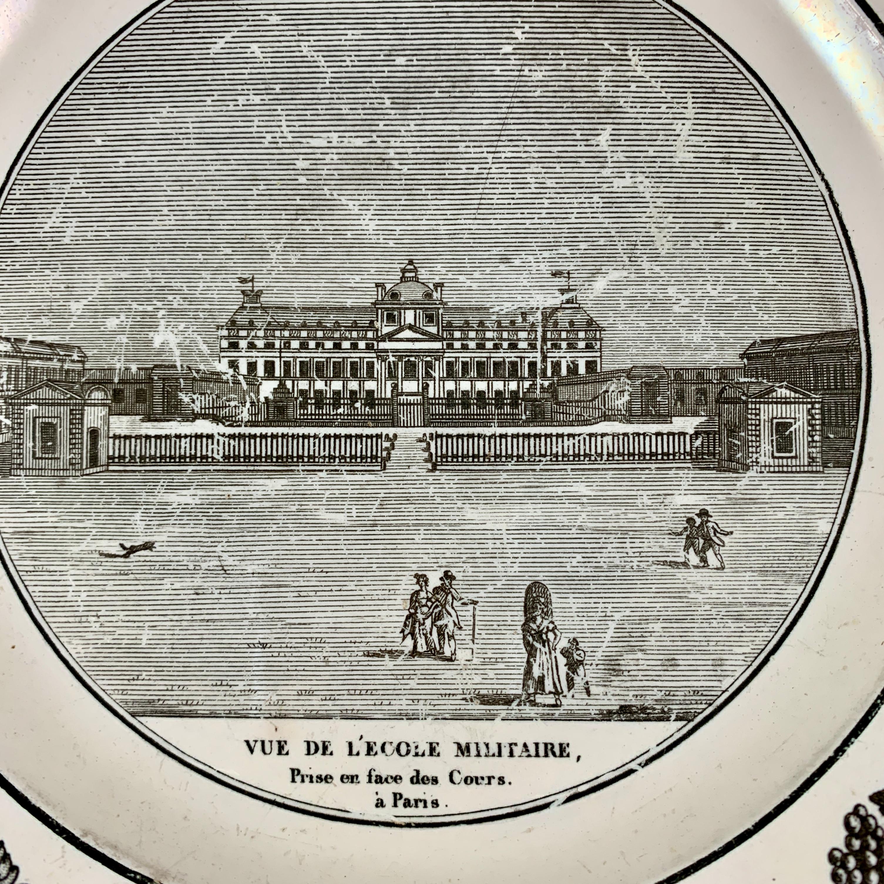 A French Neoclassical faïence transfer printed creamware plate from Stone, Coquerel et Le Gros, circa 1820-1830.

A black transfer of an architectural image on a creamware body, depicting the Vue De L’ École Militaire à Paris. The building is