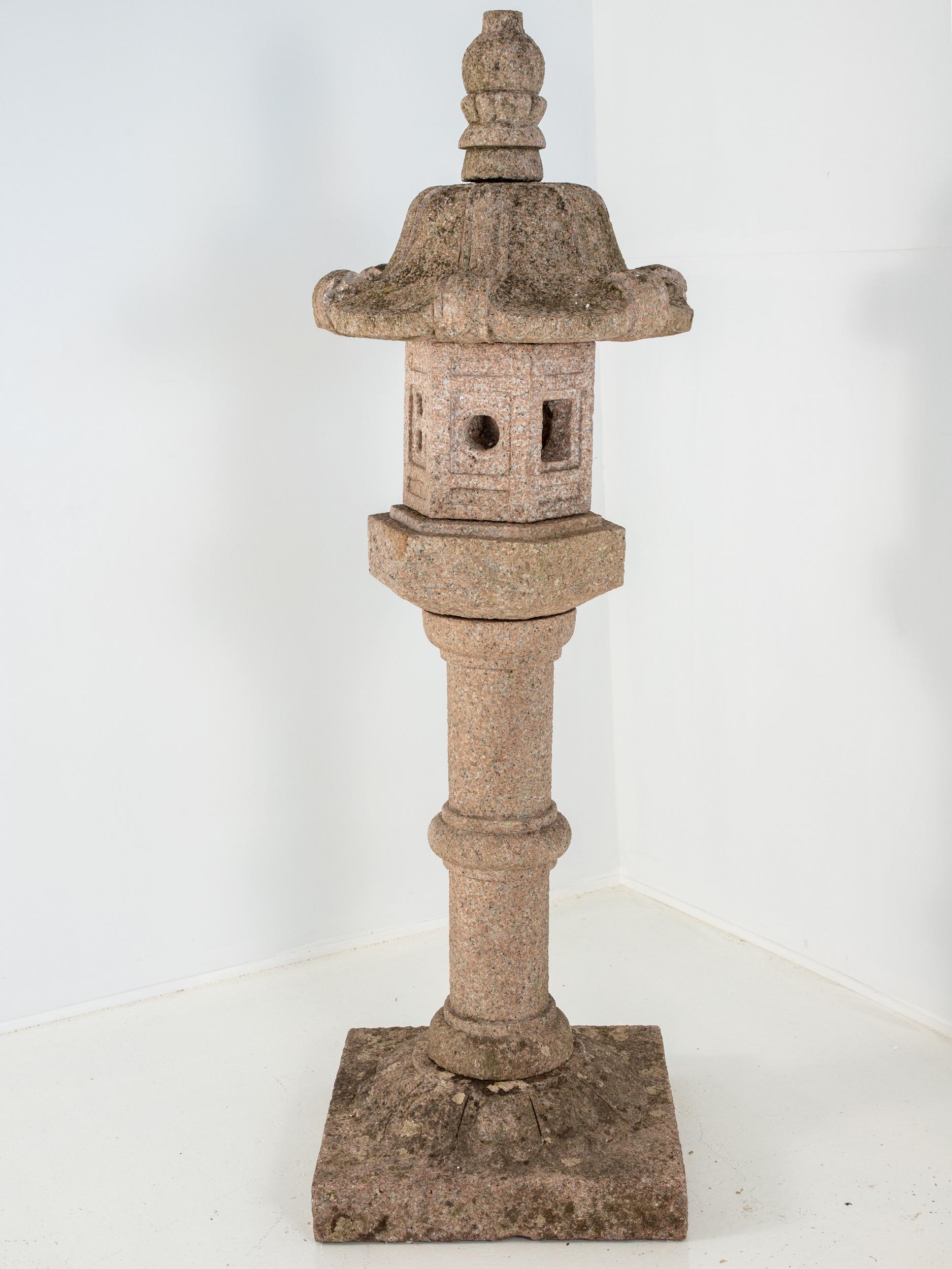 A Japanese style stone pagoda lantern or single dovecote on a pillar from the early 20th century. Constructed of multiple pieces.