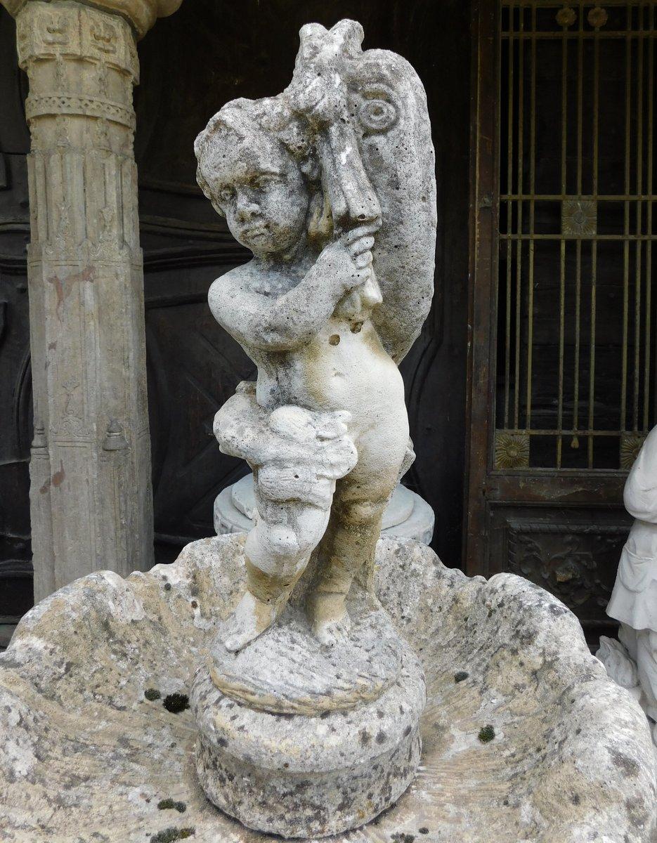Concrete stone garden fountain with carved putto, Italy For Sale