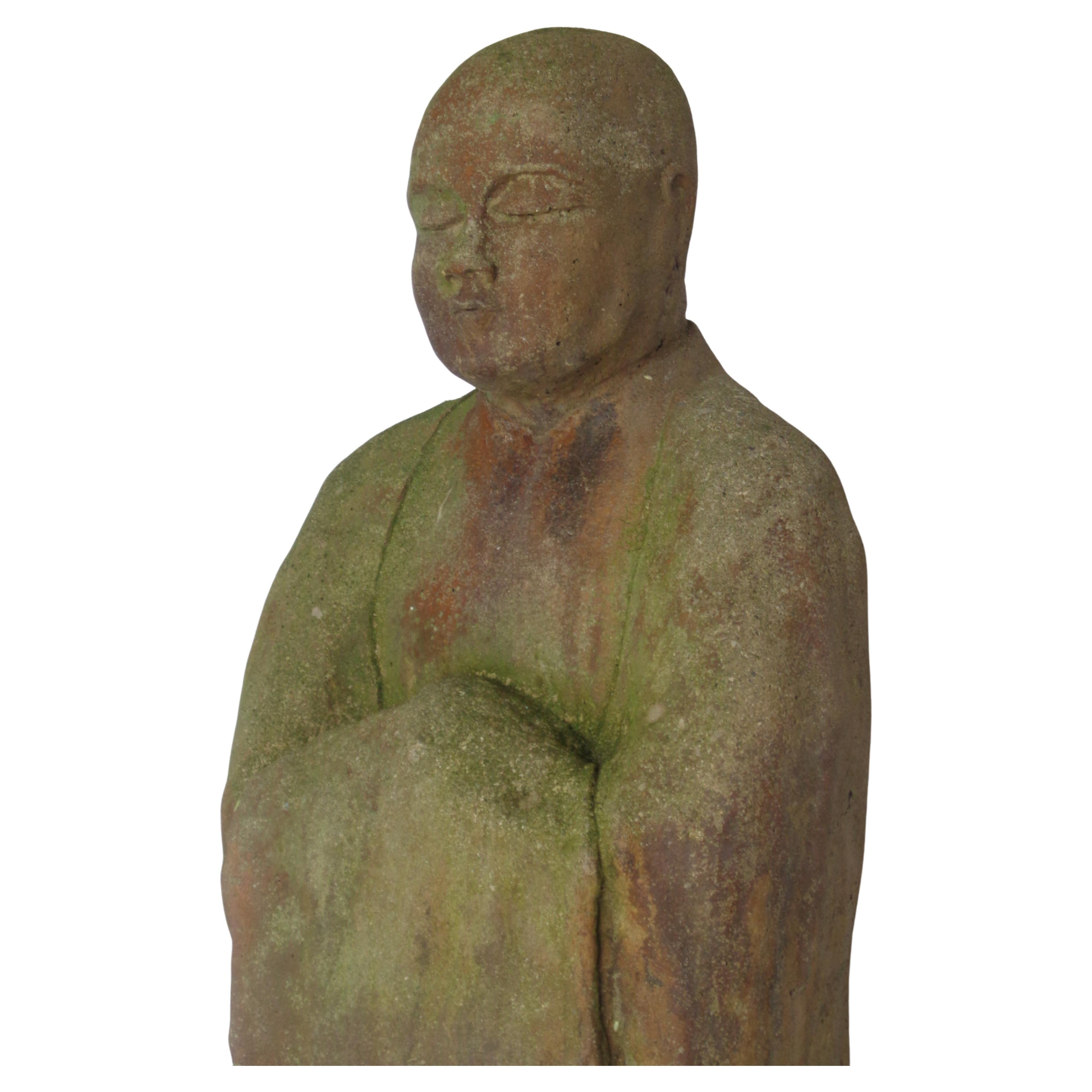 Large and heavy terracotta like carved stone statue of a standing Japanese Jizo Bodhisattva in the Kamakura period style with beautifully aged old color w/ areas of rust and algae greening from being exposed to the elements for many decades at a