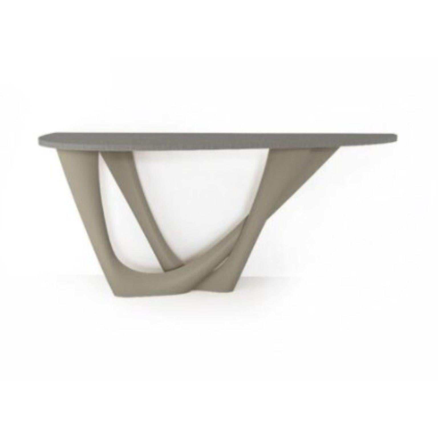 Stone Grey G-Console Duo concrete top and steel base by Zieta
Dimensions: D 56 x W 168 x H 75 cm 
Material: Carbon steel, concrete.
Also available in different colors and dimensions.

G-Console is another bionic object in our collection. Created for