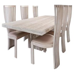 Table de salle à manger et chaises Tonon en travertin de Stone International pour Roche Bobois