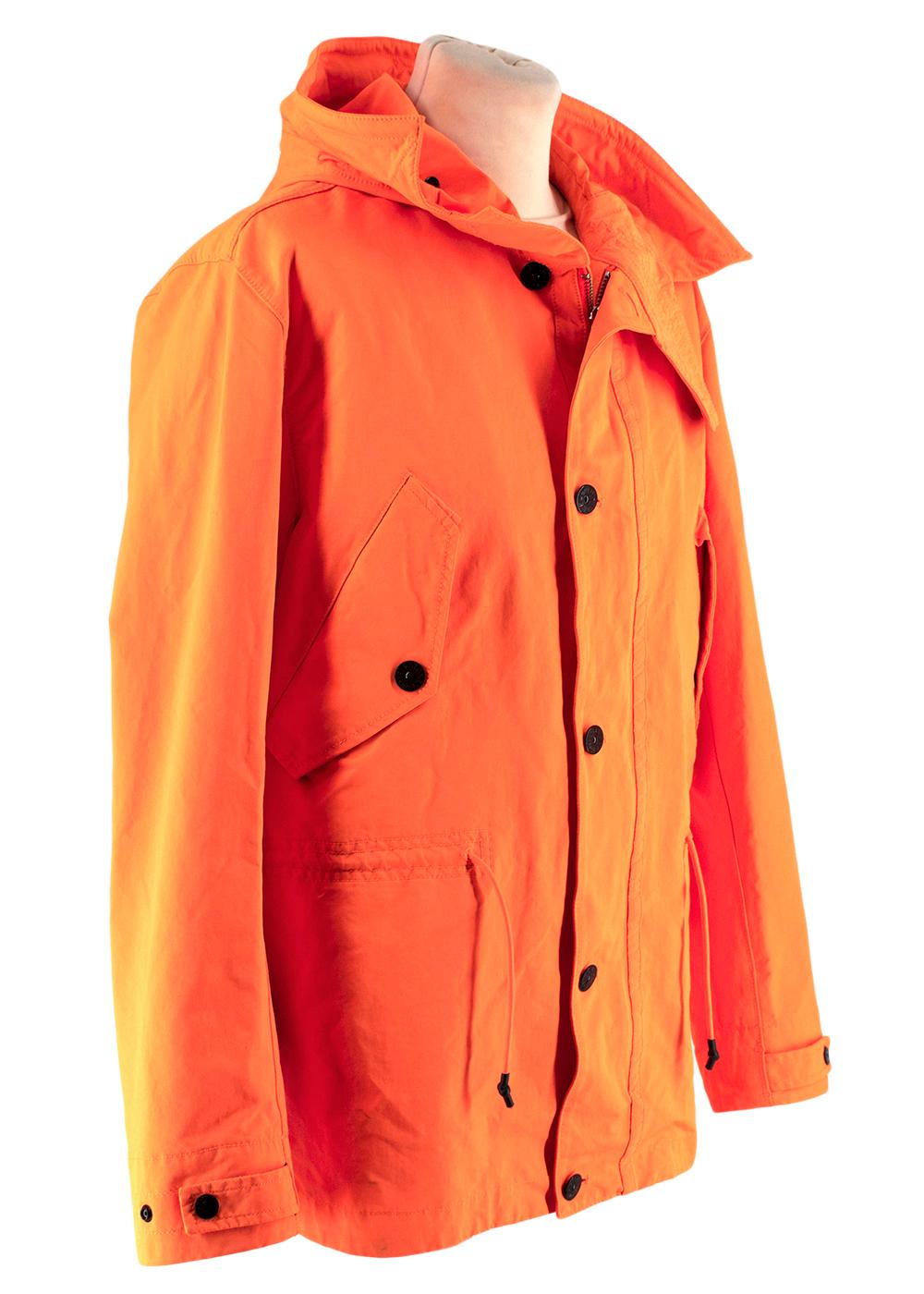 Stone Island Orange David Fluo Jacket

Ample hood with drawstring, over stitched visor and wind flap. Diagonal pockets on upper front, with flap and popper. Drawstring at waist. Strap at cuffs, adjust with poppers. Hidden double slider zipper and