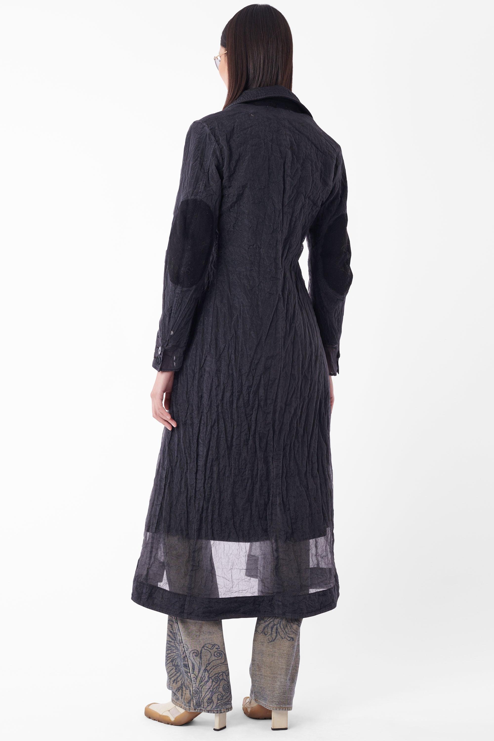 Stone Island Serie 100 black mesh long coat. Between 2001 and 2004 Stone Island produced six seasons of Serie 100 - Collectors pieces. Features lapel, button front with fleece panelling, buttons at wrist, double layer with sheer outer and front