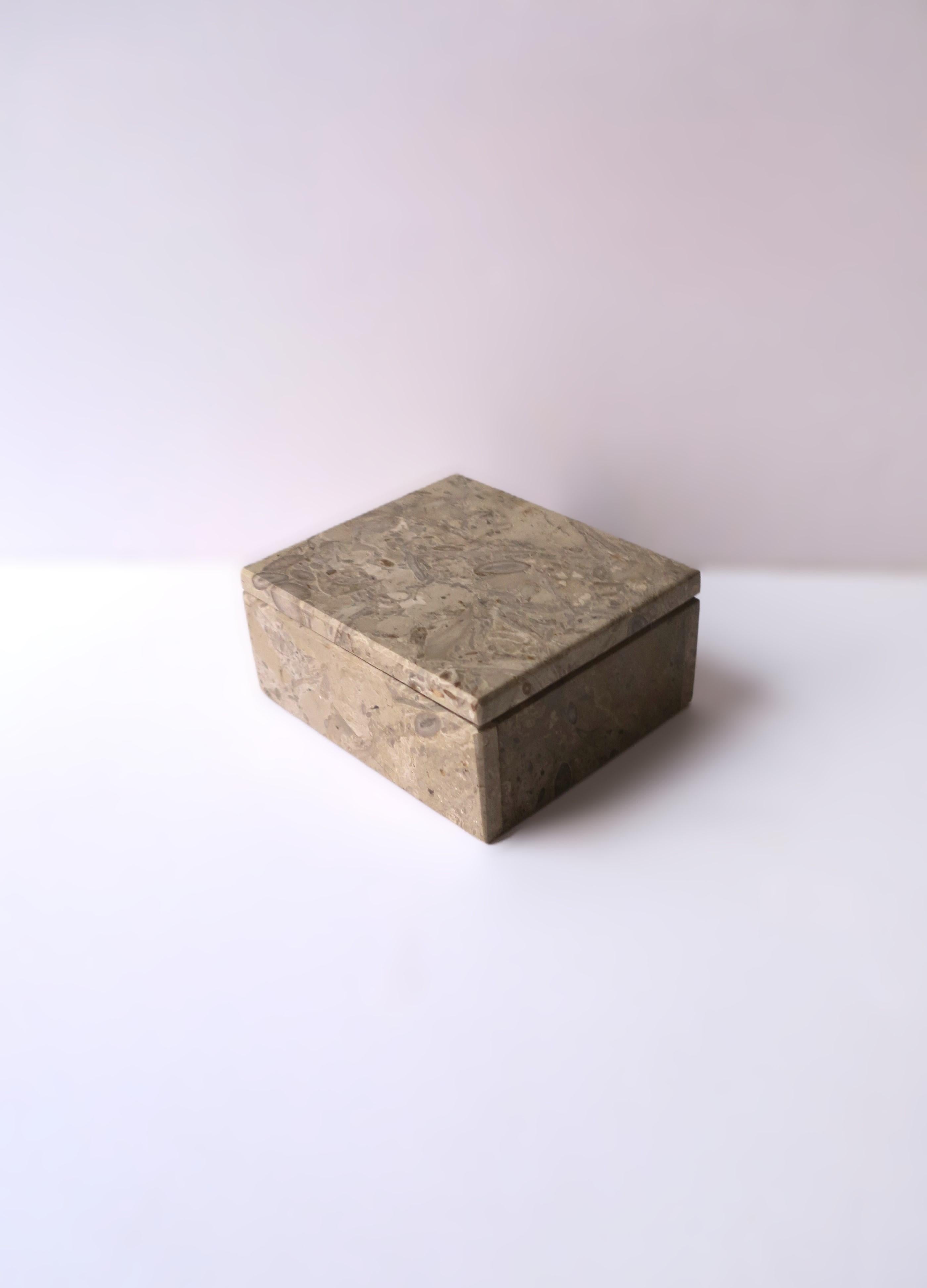 A neutral hue stone box, jewelry or decorative, in the Modern or Minimalist styles, circa late-20th century. A great piece to hold jewelry (demonstrated) or other small items on a desk, vanity, nightstand, walk-in-closet, etc. Very good condition as