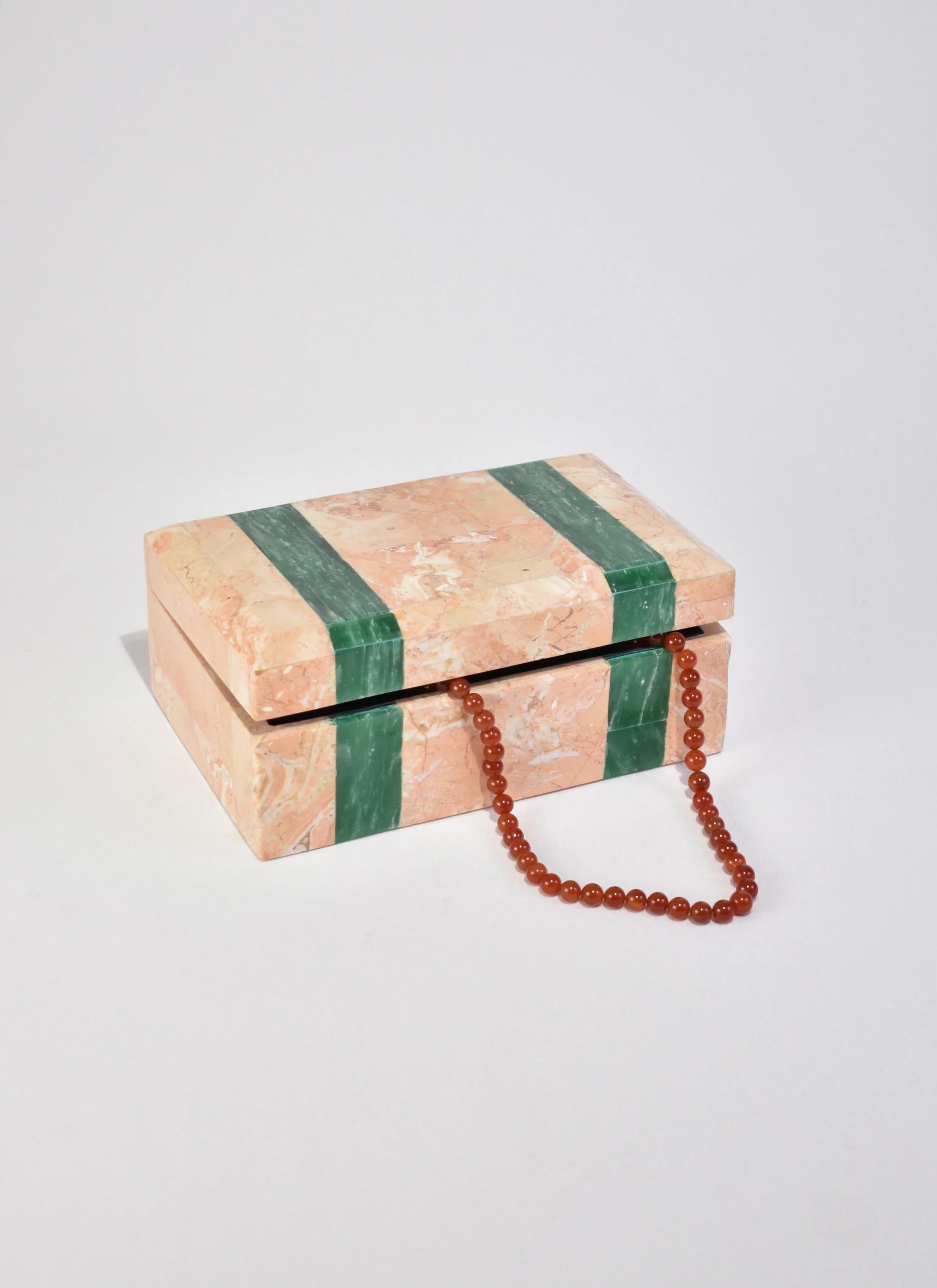 Stunning vintage pink marble jewelry box with green stone inlay and black velvet lining.