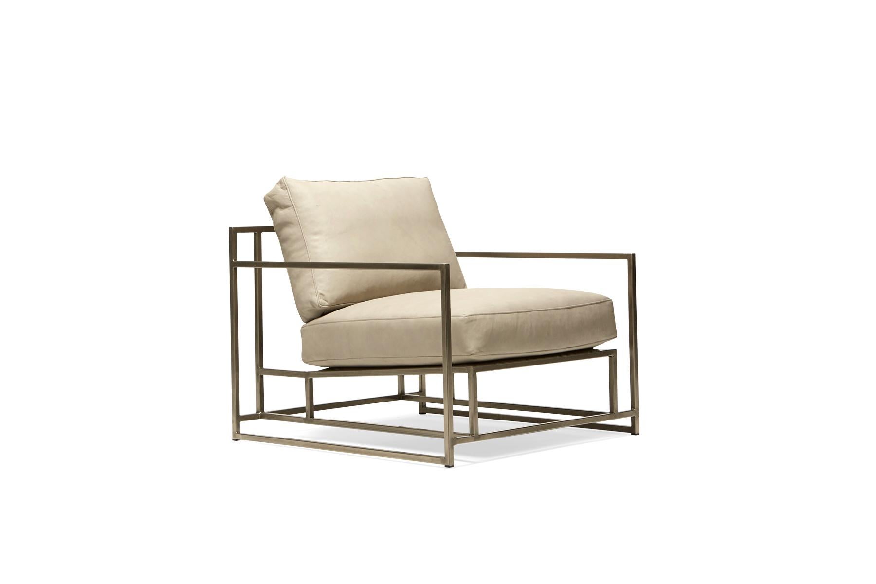 The Inheritance Armchair by Stephen Kenn is as comfortable as it is unique. The design features an exposed construction composed of three elements - a steel frame, plush upholstery, and supportive belts. The deep seating area is perfect for a