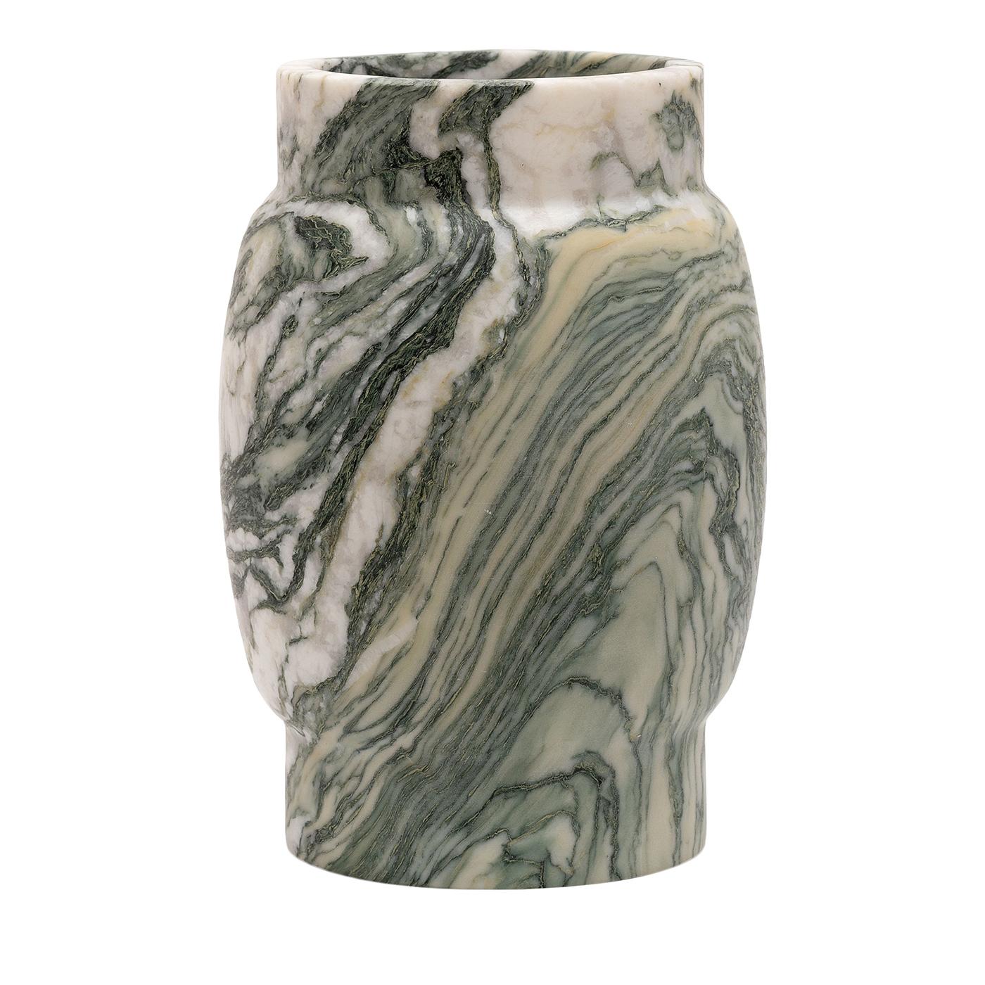 The Luana S vase is carved from green Luana marble sourced from the unique quarry in the apuan alps in tuscany. This vase features a dark background enriched with green and multicolored veins, creating a visually captivating pattern. Its smooth