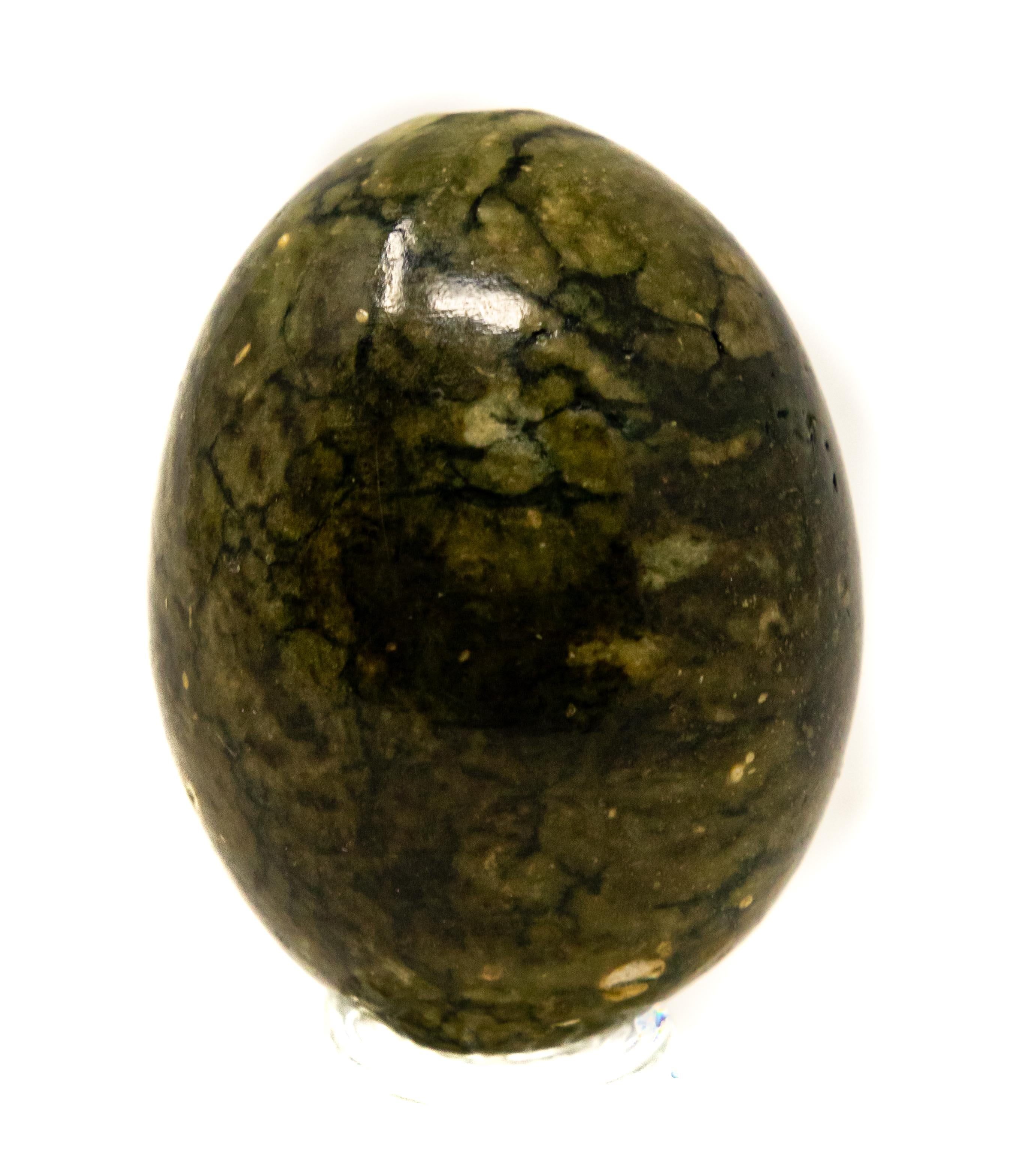 Offering this natural marble stone egg. In deep earth tone colors and natural striations this polished marble stone egg is beautiful.