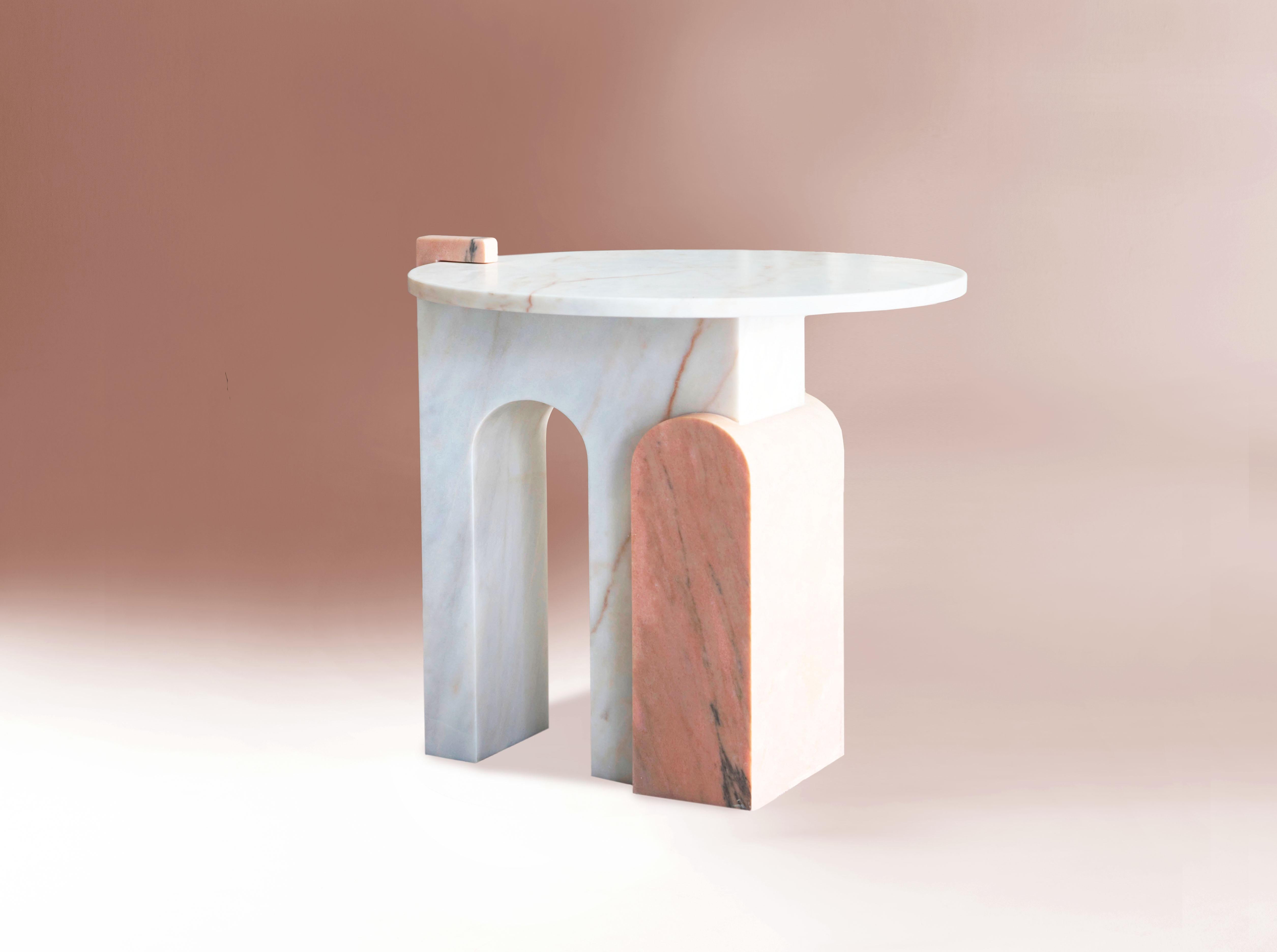 This table is a symbolic piece of the collection. Thanks to its architectural forms and the mixture of marble, it becomes a delicate piece of art. 
Handmade in Portugal*

Dimensions:
H: 60 cm 23 in. Ø 60 cm 23 in.
Materials
Estremoz white