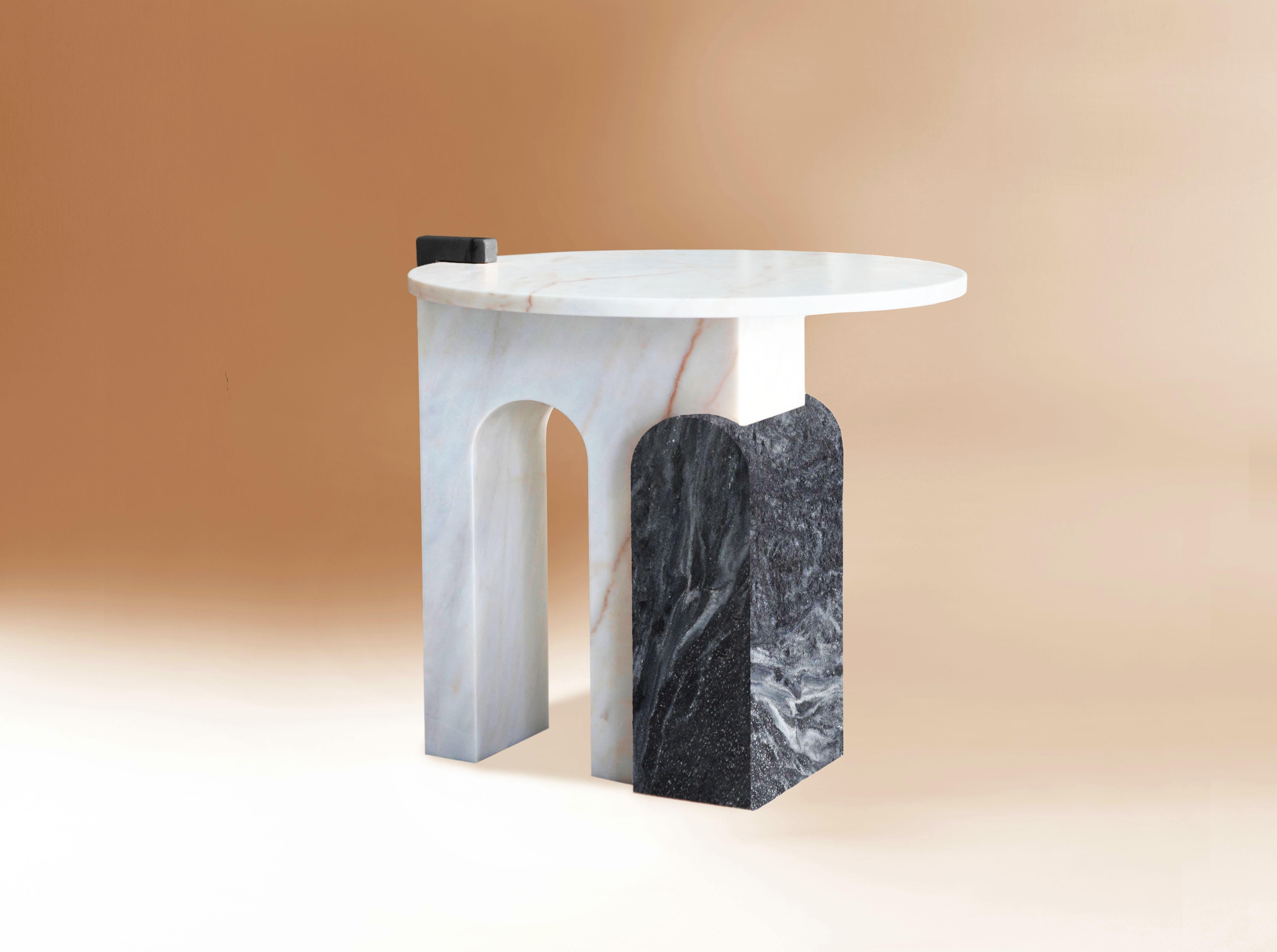 This table is a symbolic piece of the collection. Thanks to its architectural forms and the mixture of marble, it becomes a delicate piece of art.
Dimensions:
H: 60 cm 23 in. Ø 60 cm 23 in.
Materials
Estremoz white marble + Ruivina black marble.